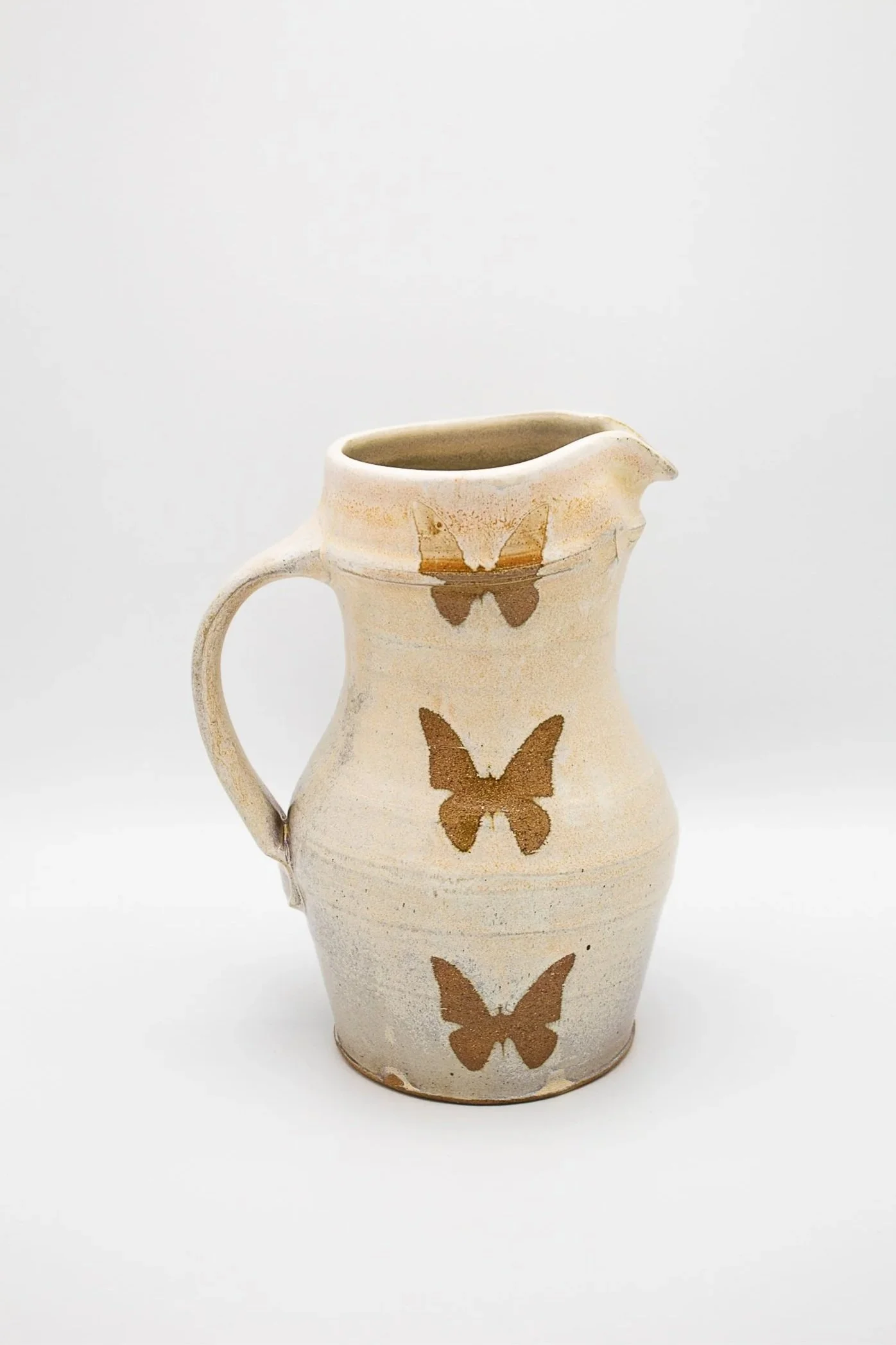Butterfly Pitcher, stoneware, rutile glaze, soda-fired, (7 x 7 x 12 in), 2023.