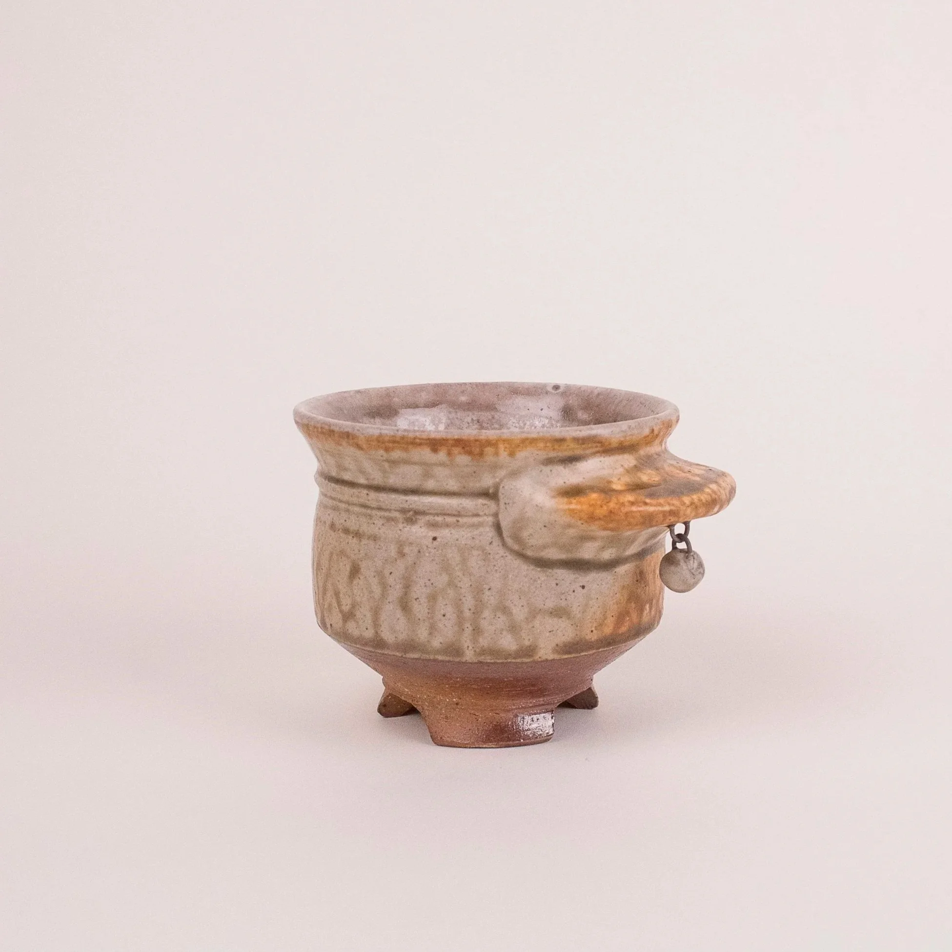 Yunomi w/ dangly, stoneware, ash glaze, gas-fired, (4 x 4 x 4 in), 2025.