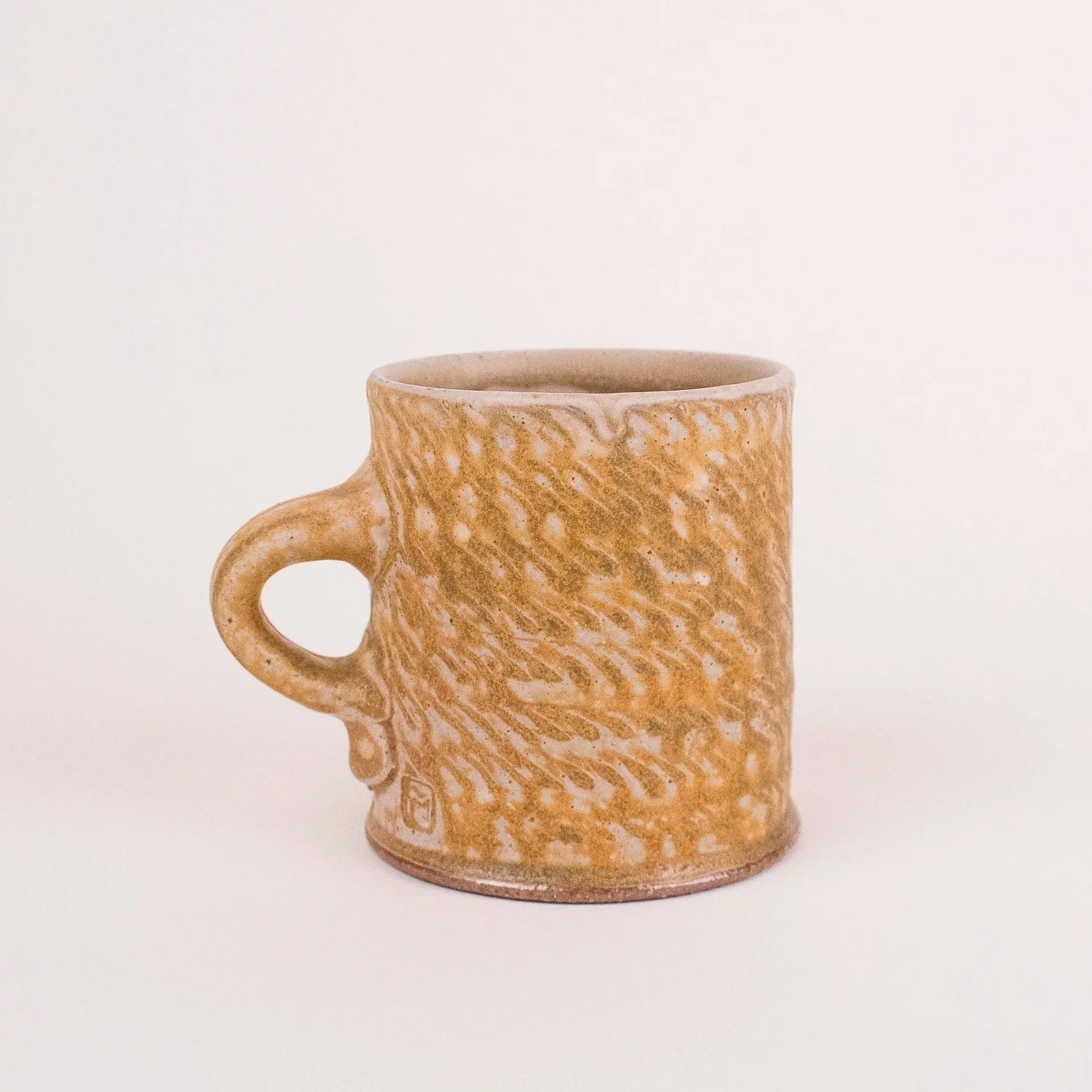 Textured Mug #2, stoneware, ash glaze, salt-fired, (4 x 4 x 4 in), 2023.)
