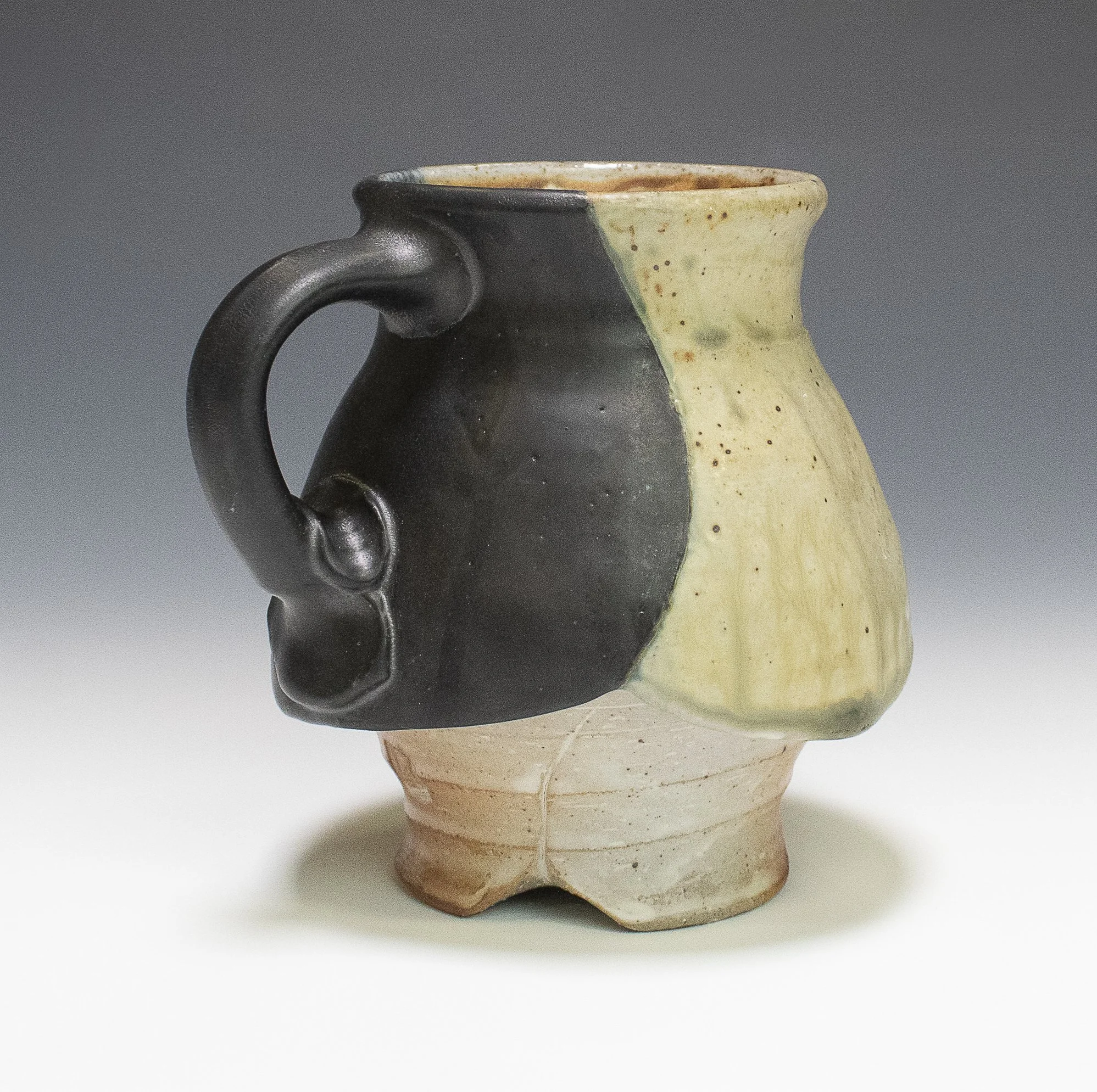Winged Mug #1, stoneware, white slip, ash glaze, soda-fired, (5 x 5 x 5 in), 2024.