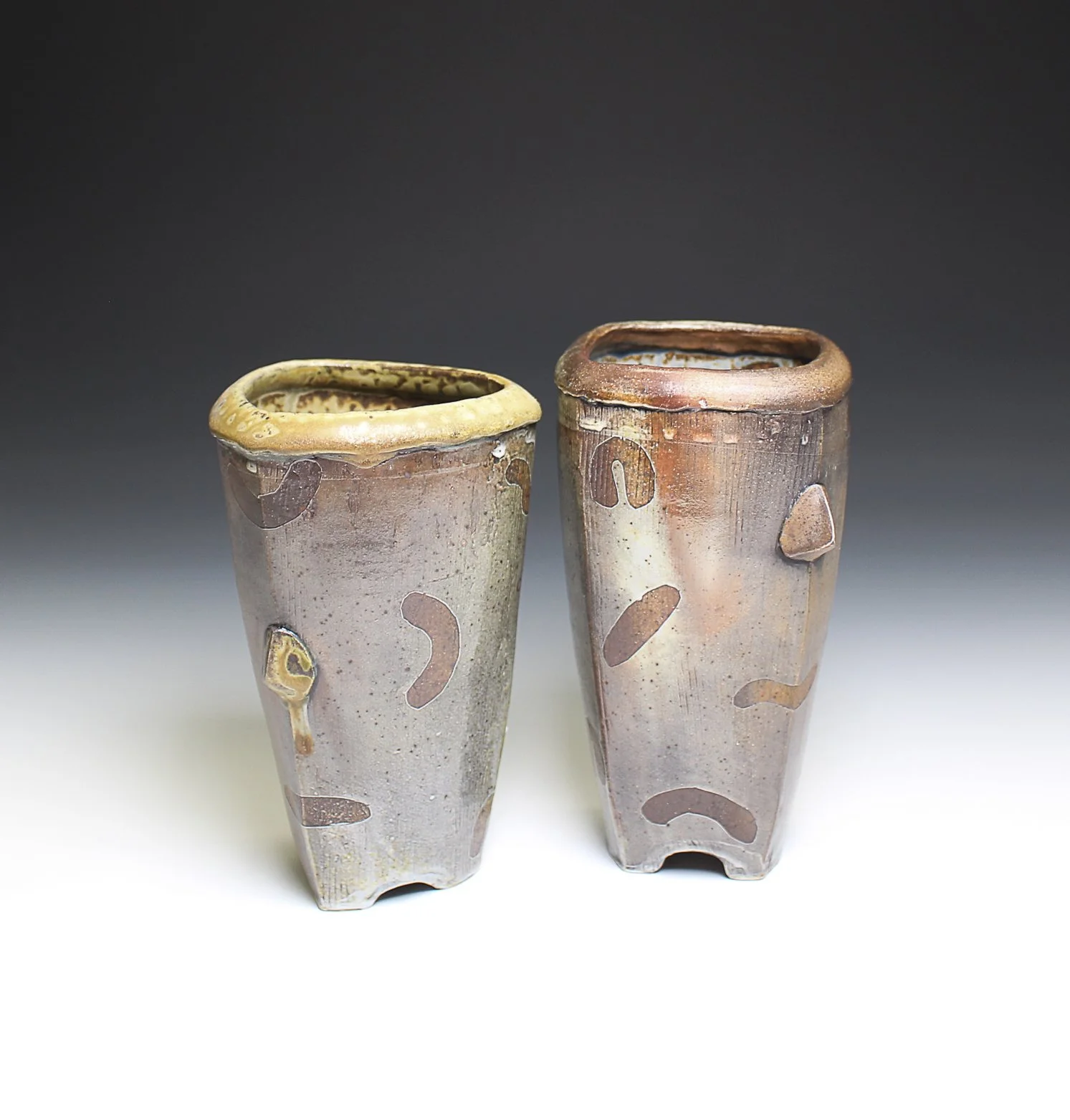 Outbreak Vases, stoneware, white slip, underglaze wash, ash glaze, wood fired, (4 x 4 x 10 in), 2025.
