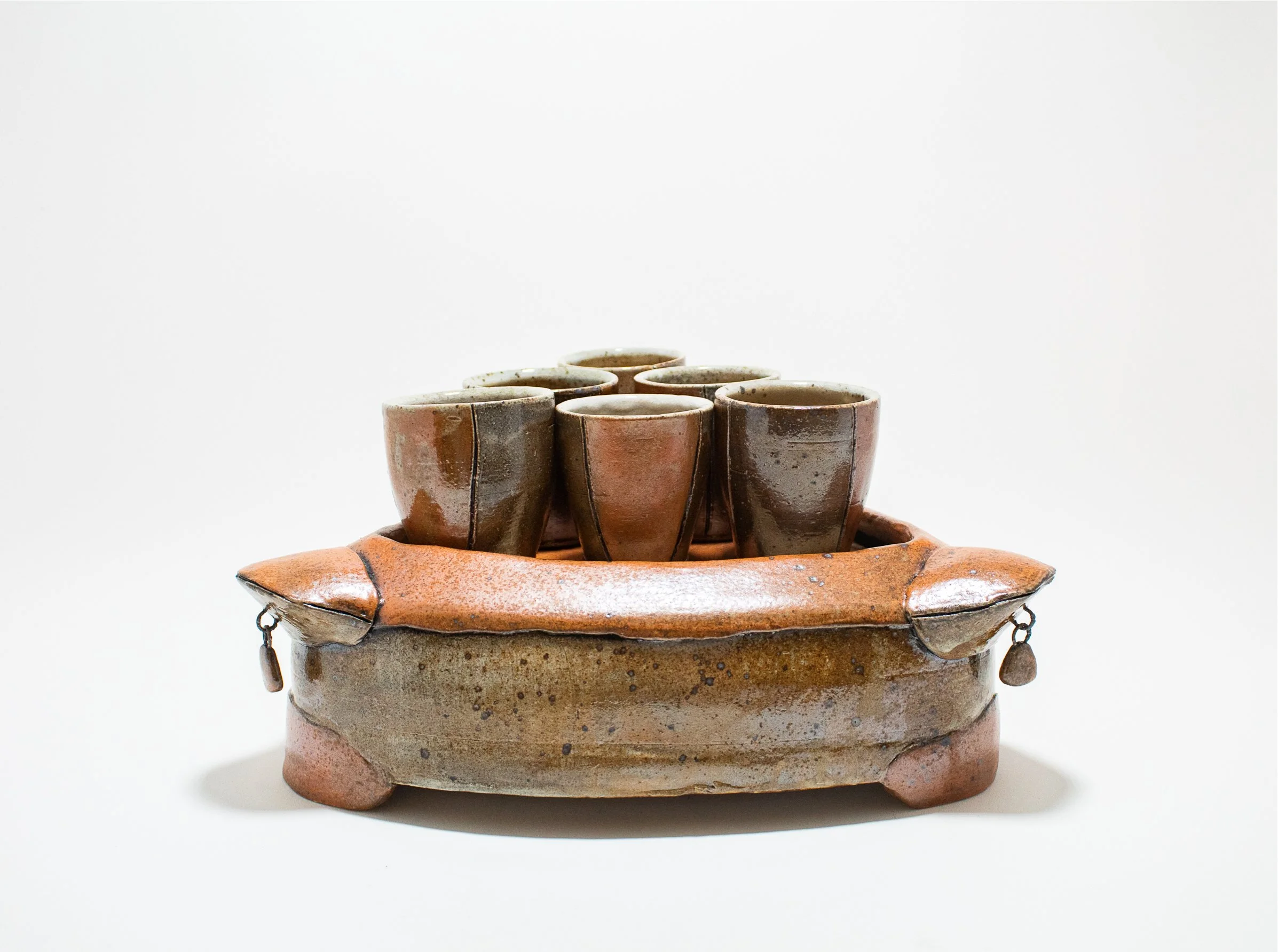 Shot Caddy, stoneware, white slip, flashing slip, underglaze wash, nichrome wire, wood-fired, (10 x 10 x 6 in.)