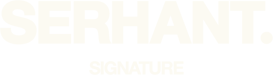 White signature text reading 'SERHANT' with smaller text 'SIGNATURE' beneath