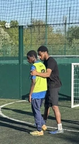 1 to 1 football coaching in Milton Keynes with coach helping young player improve technique.
