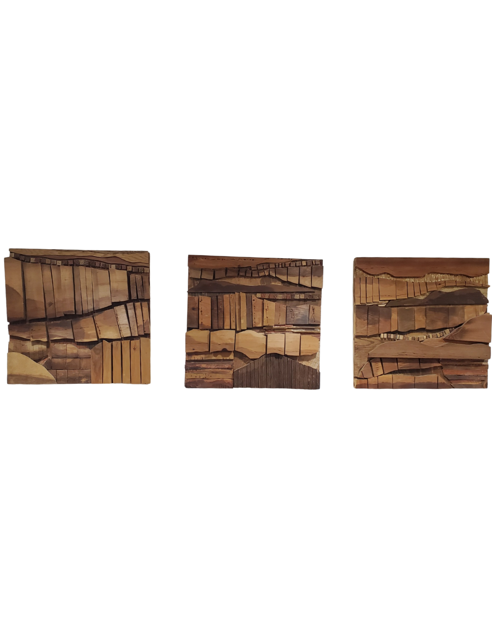 Three small stacks of variously cut and arranged wooden sticks or strips on a white background.