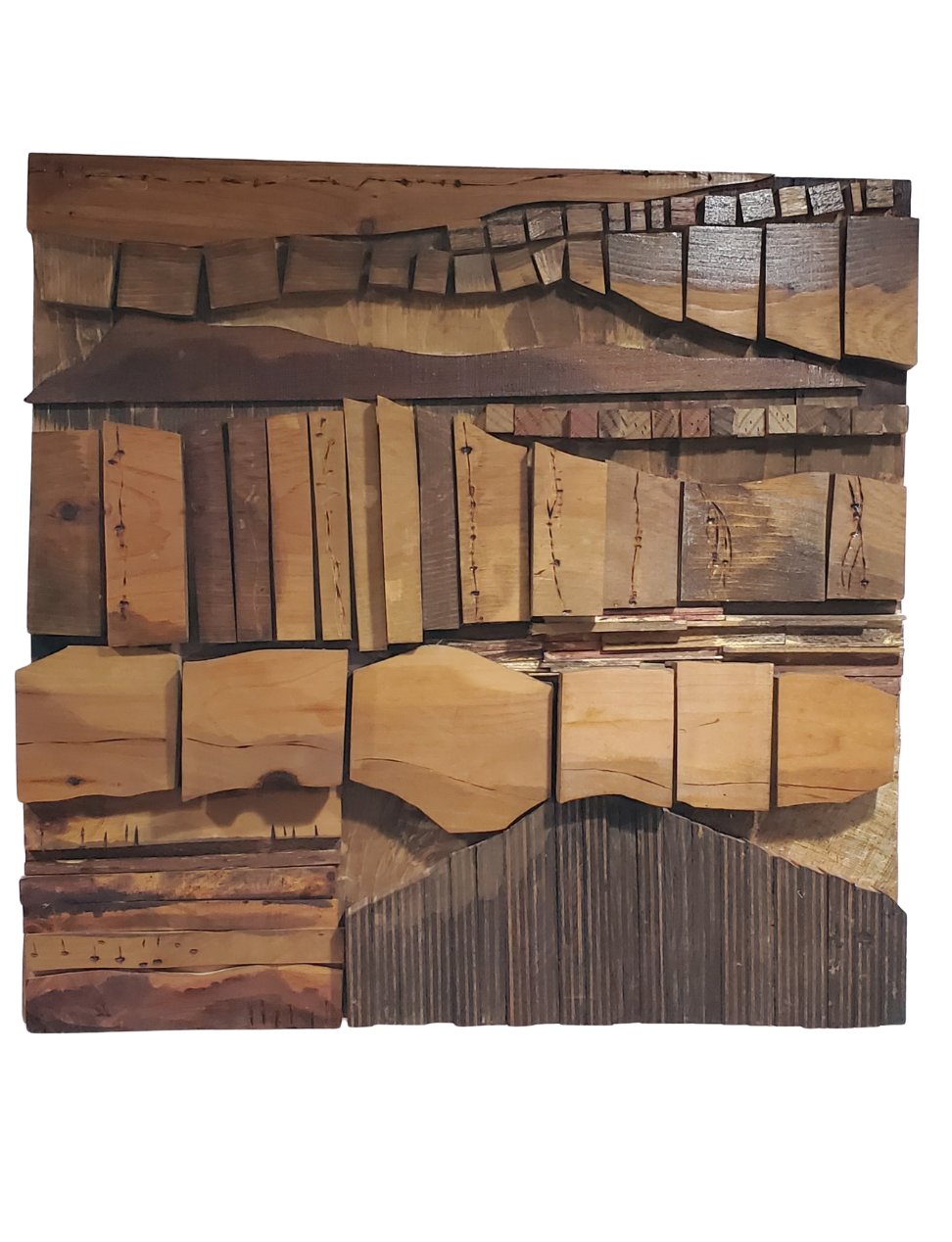 A collection of various cut wooden pieces arranged in a square pattern, showcasing different types, colors, and textures of wood.