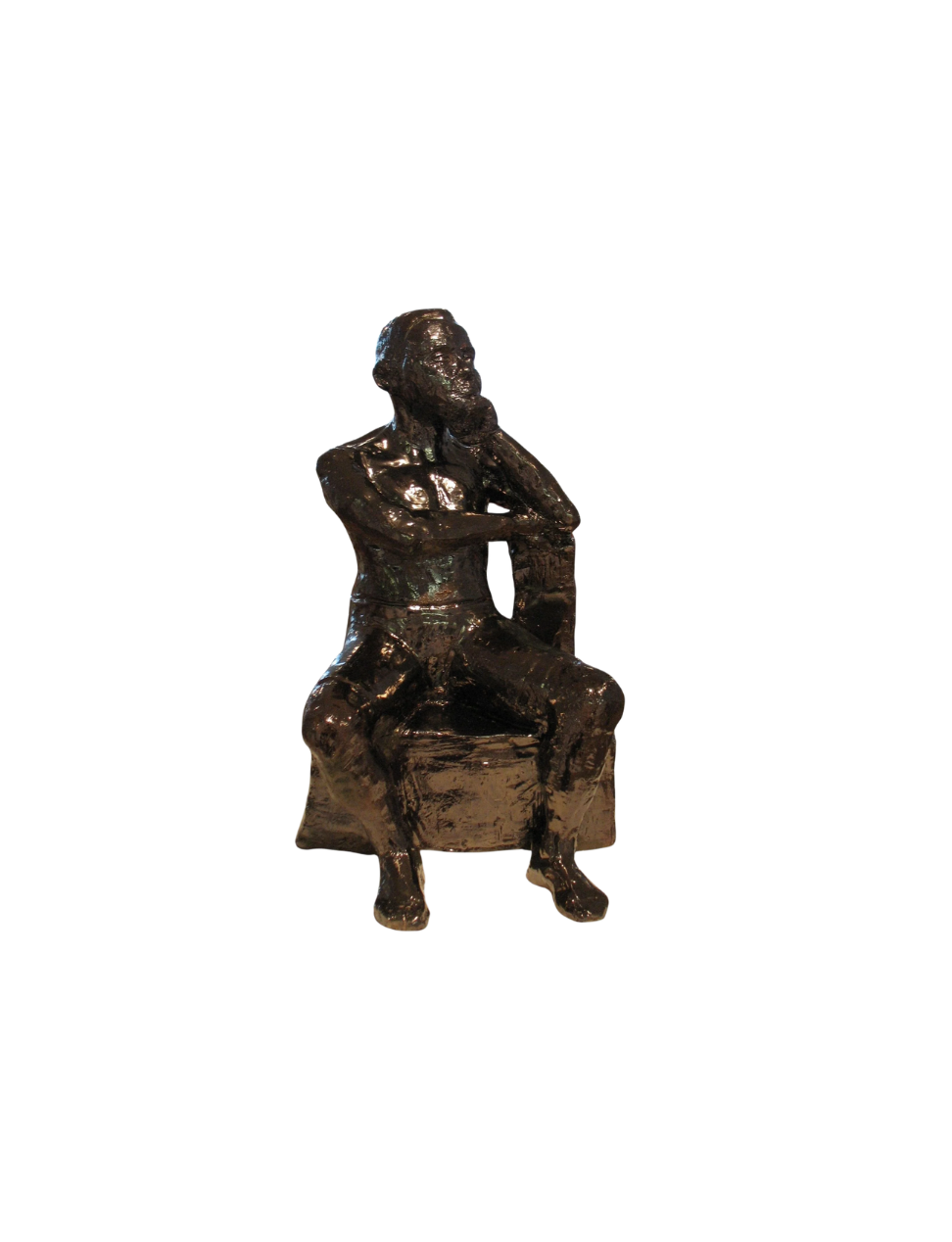 Bronze sculpture of a man sitting on a bench, with one leg crossed over the other, resting his chin on his hand, in a thoughtful pose.