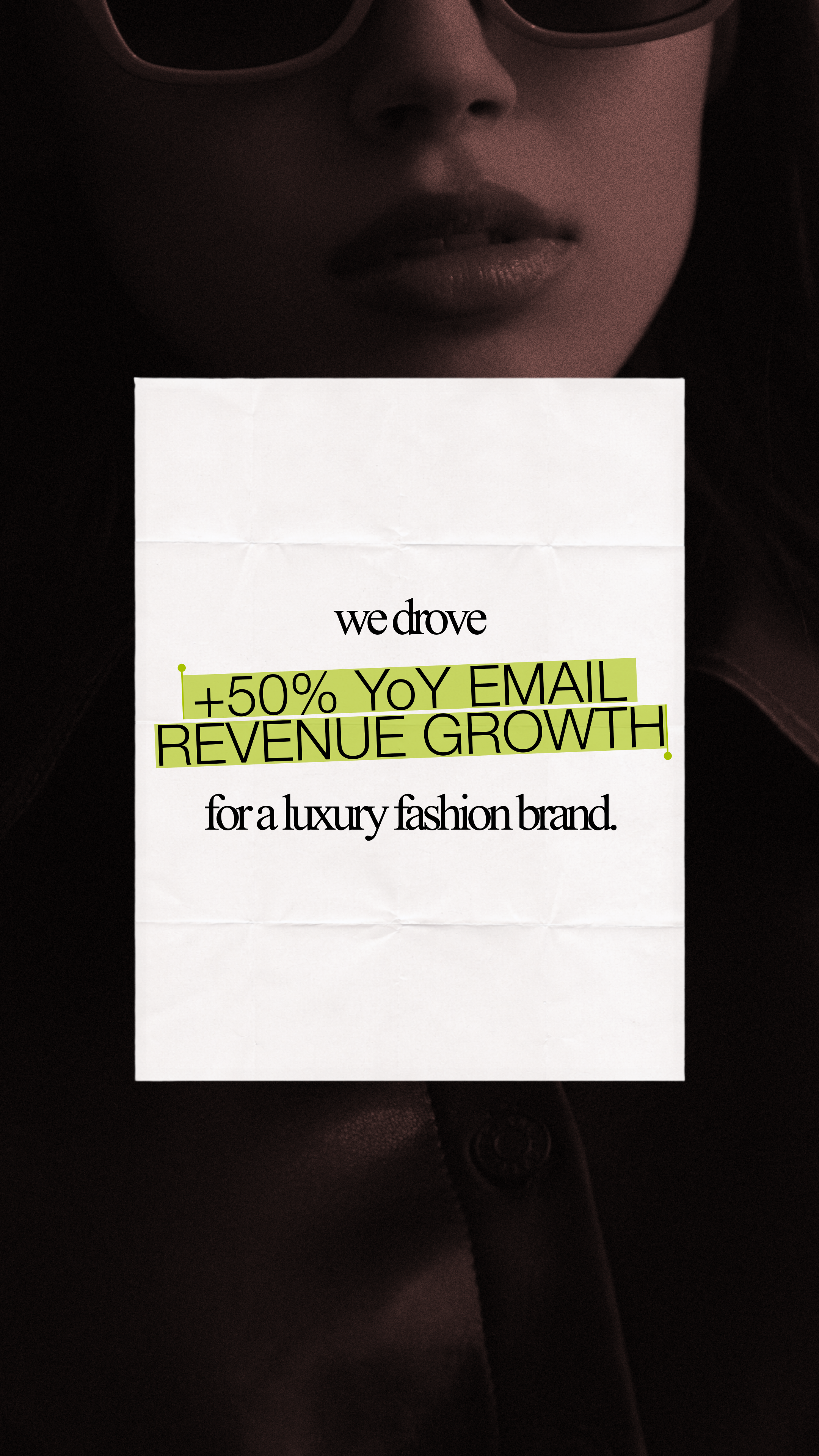 Close-up of a woman wearing sunglasses holding a sign that says '+50% YoY email revenue growth for a luxury fashion brand.'