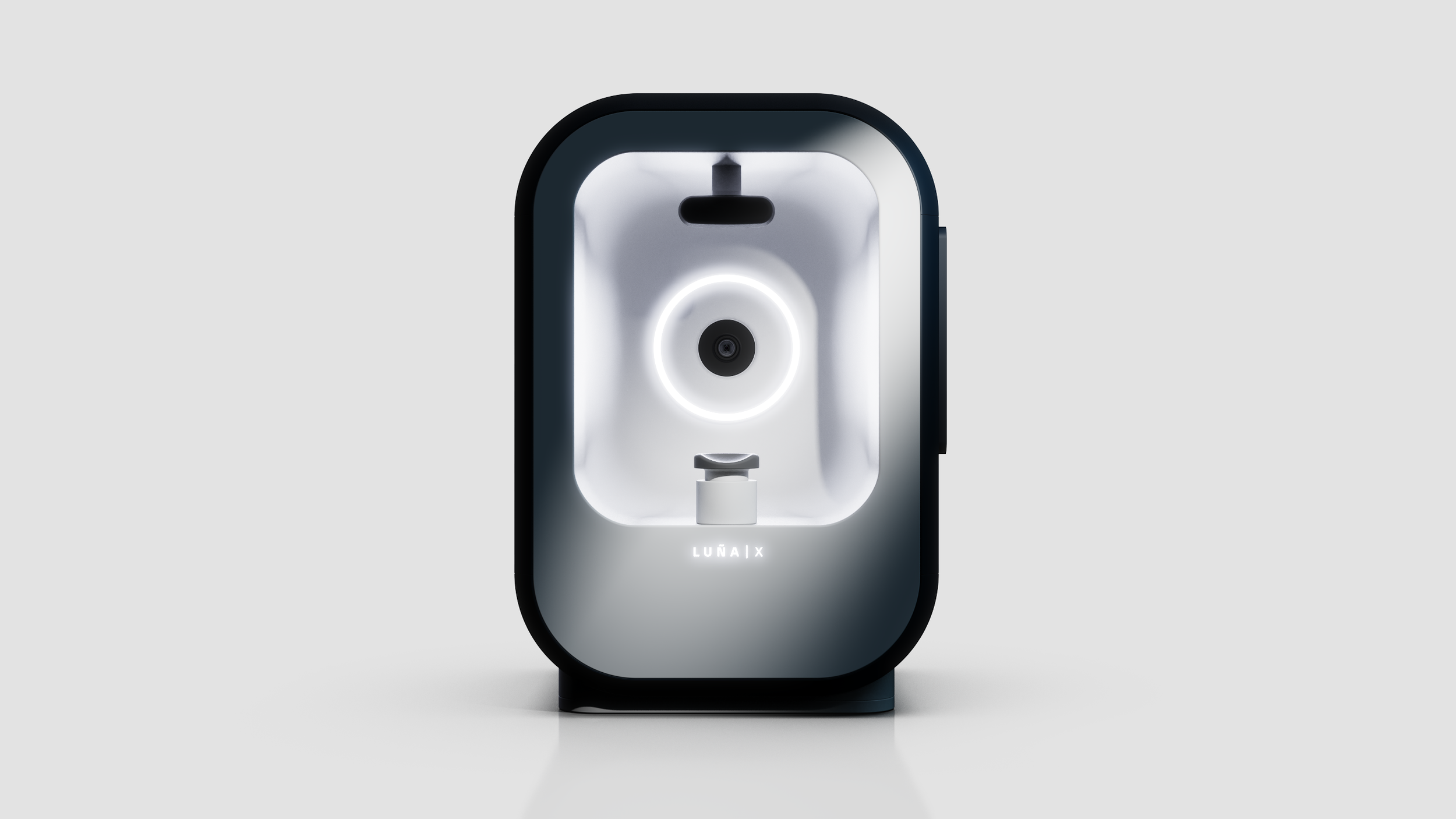 A sleek, modern LUNA X face mask scanner with a black and white design, a circular scanning area illuminated by a soft white light, and the product name at the bottom.