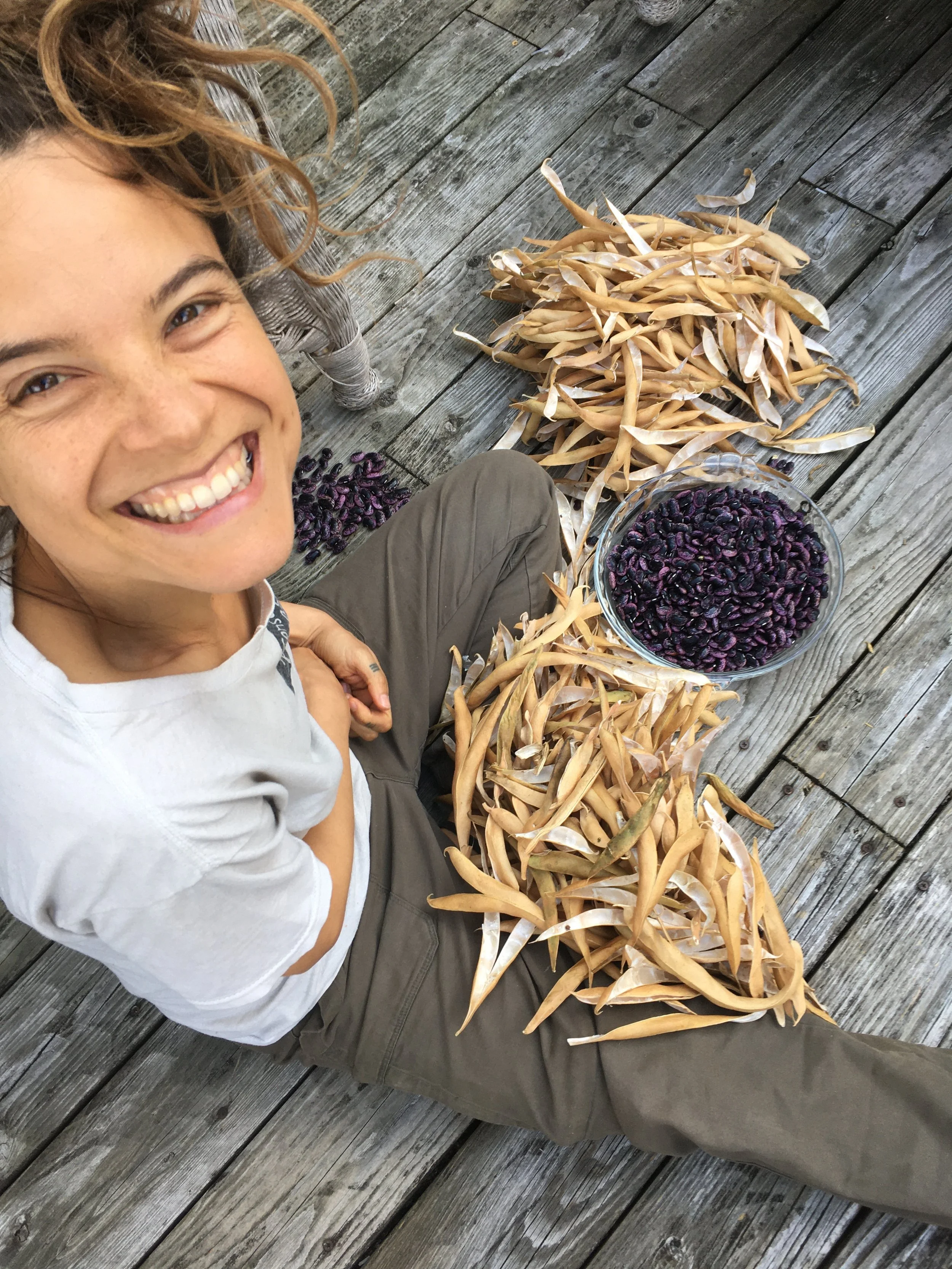 permaculture farmer with sustainably grown runner beans, grown using better-than-organic standards
