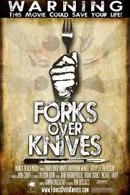 A poster with a warning message about a movie titled 'Forks Over Knives', featuring a hand holding a fork upright, with the background in muted tones.