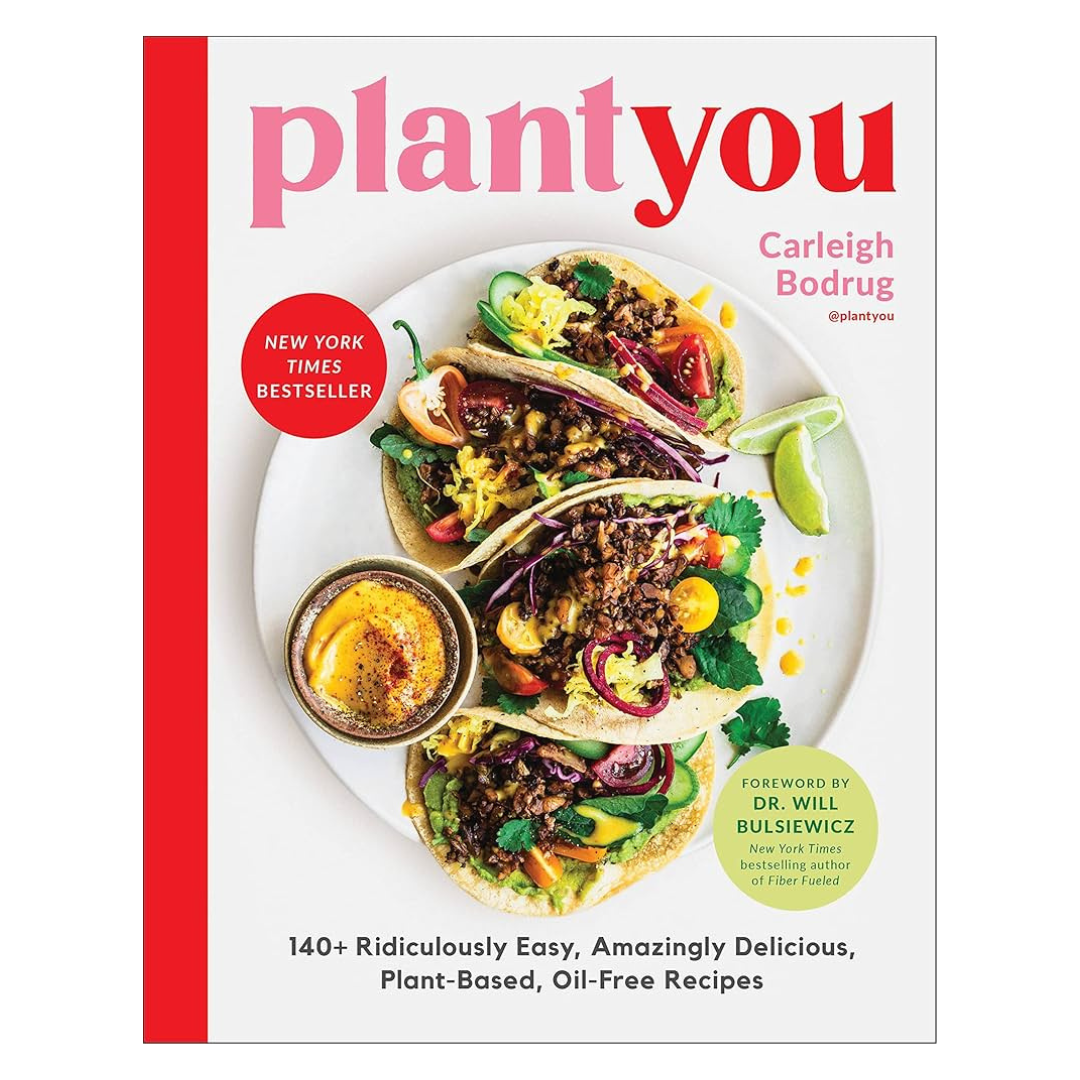 Cover of a plant-based cooking book titled 'Plant You' by Carleigh Bodrug, featuring a plate of tacos with vegetables and a small bowl of sauce.