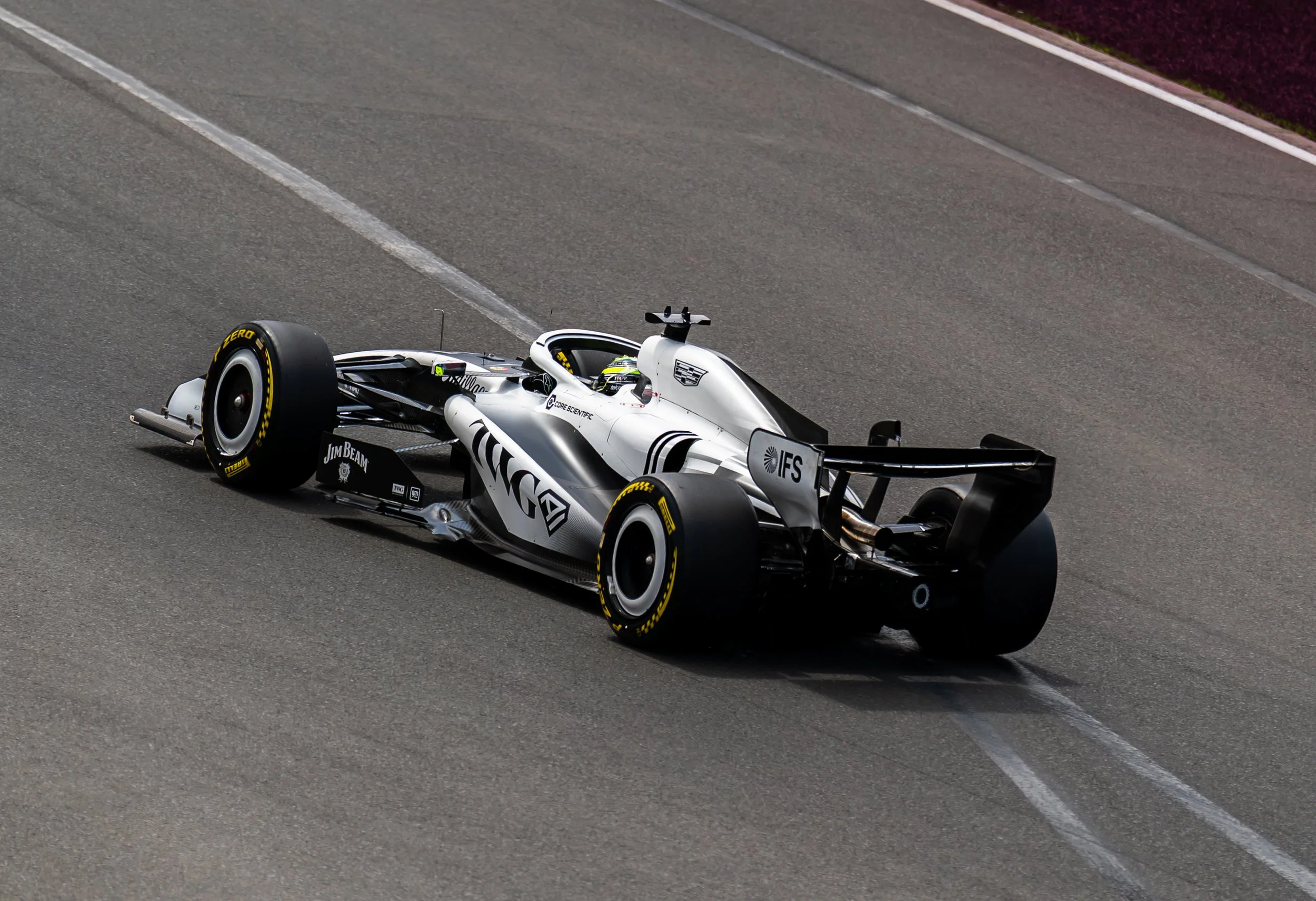 A sleek white and black open-wheel race car speeding down a racetrack. cadillac f1 australian Grand Prix 2026 Valteri Bottas 