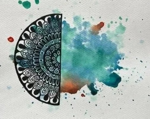 A half black and white mandala pattern on the left side, with colorful splashes of watercolor paint on the right side.