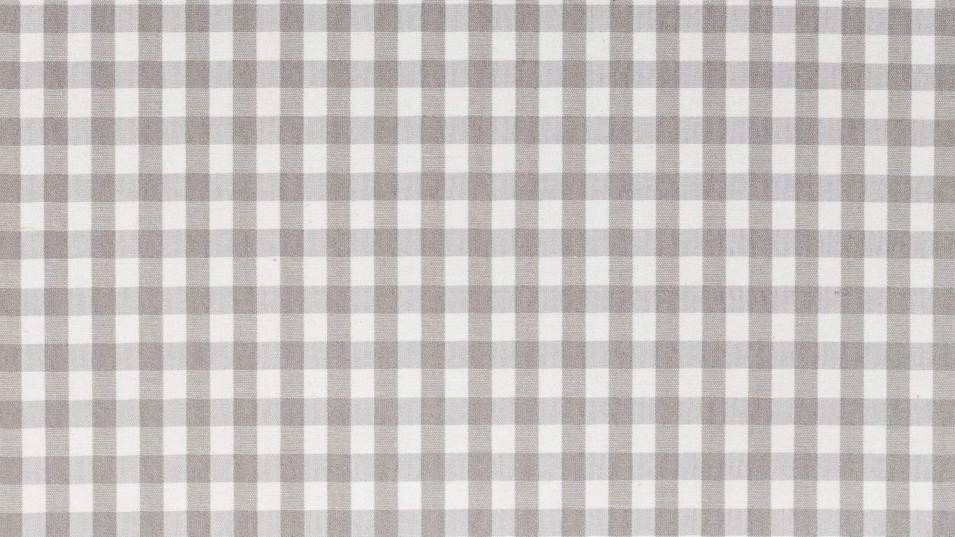 Blank checkered tablecloth in beige and white colors.