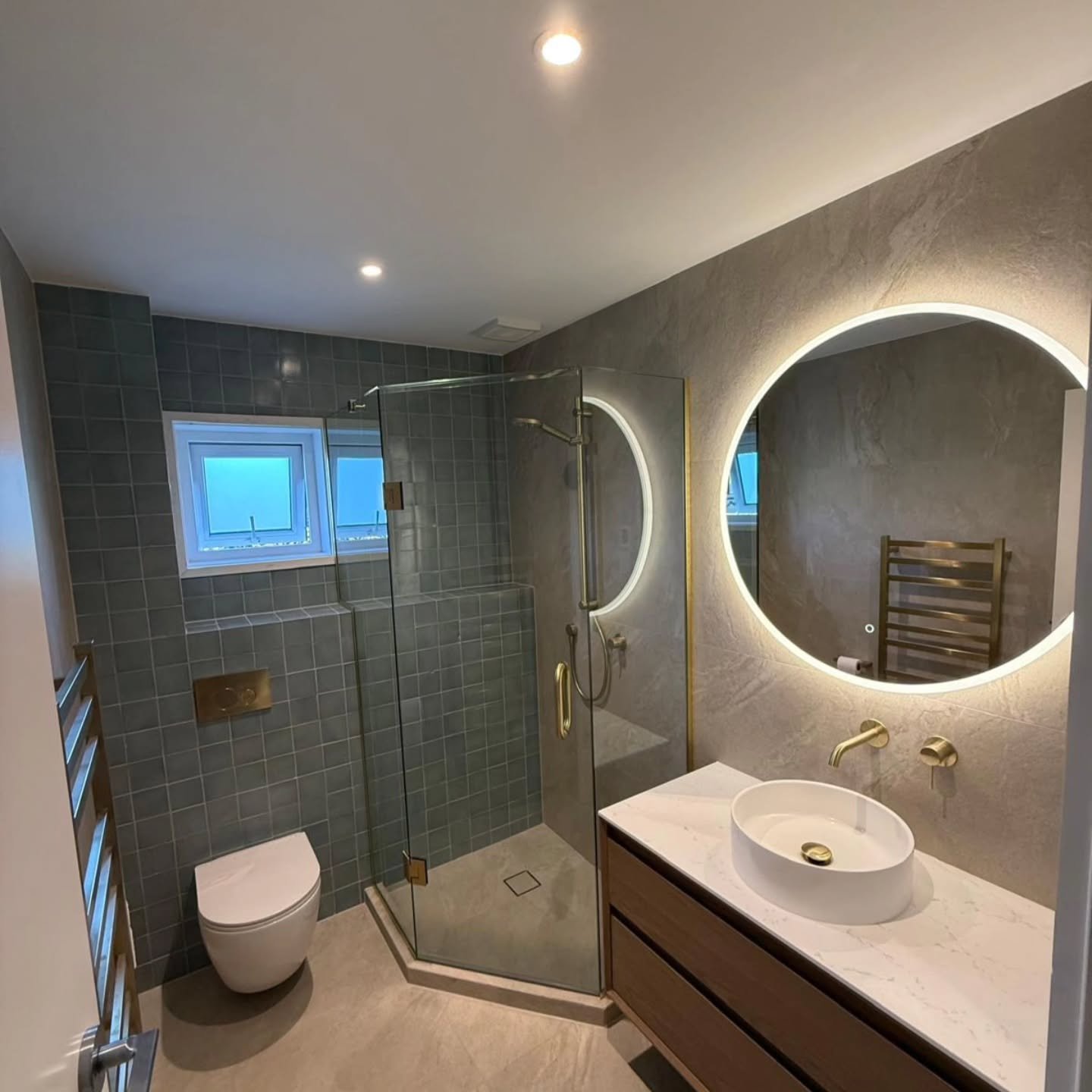 Finished bathroom renovation, an upgrade to lighting &amp; power. Addition of LED mirror, recessed dimmable downlights, Under floor heating and concealed wiring for the heated towel rail. 

#aucklandelectrician  #bathroomlighting #lightingdesign #mod