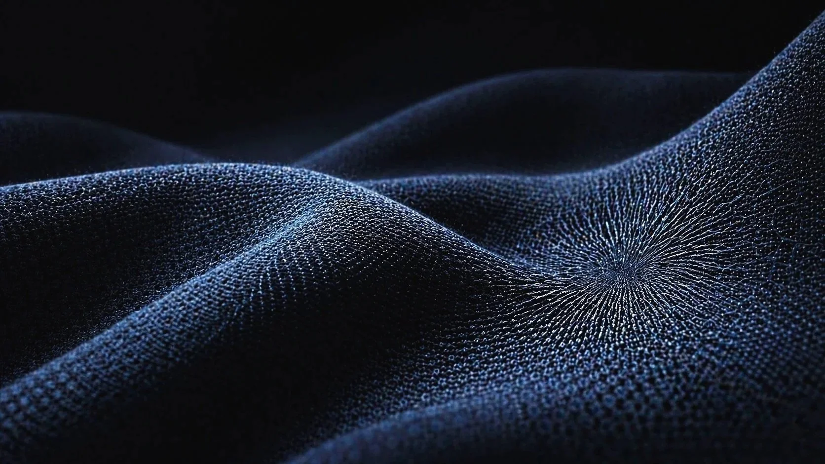 Abstract digital image of a dark fabric-like surface with glowing blue dots forming swirling patterns and ripples.