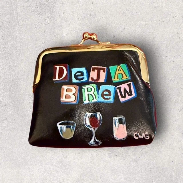 A black coin purse decorated with colorful letter blocks spelling "Data Brew" and illustrations of three glasses of different beverages.