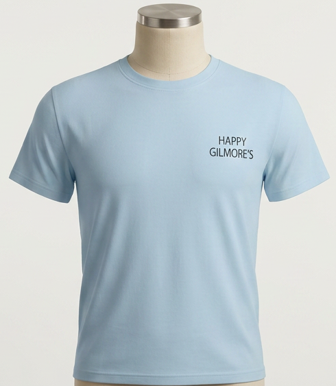 Light blue T-shirt with black text that reads 'HAPPY GILMORE'S' on the upper left chest area