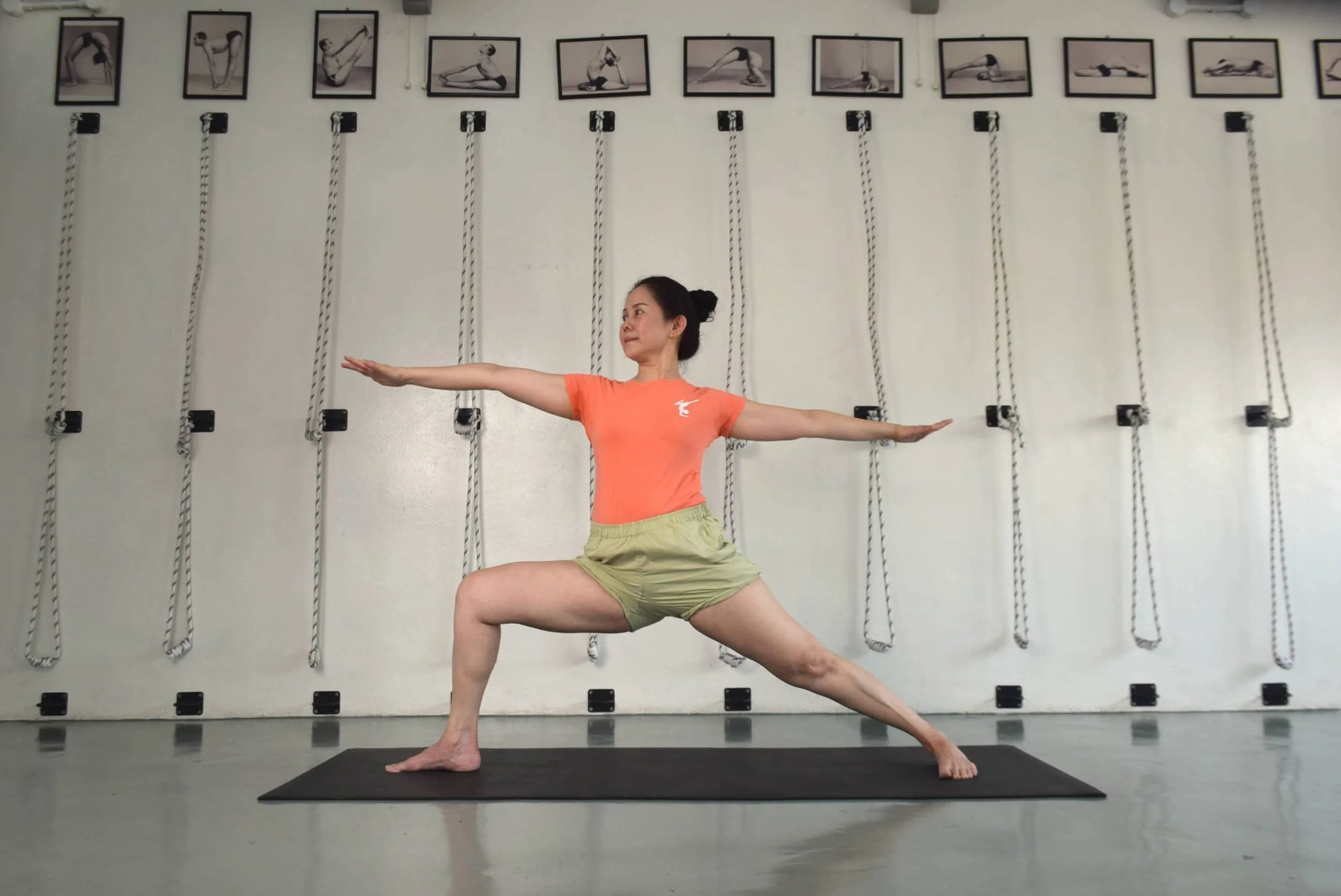 Simple Life Yoga Kepong teacher demonstrating Iyengar yoga poses on a yoga mat