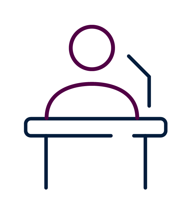 Outline of a person sitting at a desk with a computer and a chair.