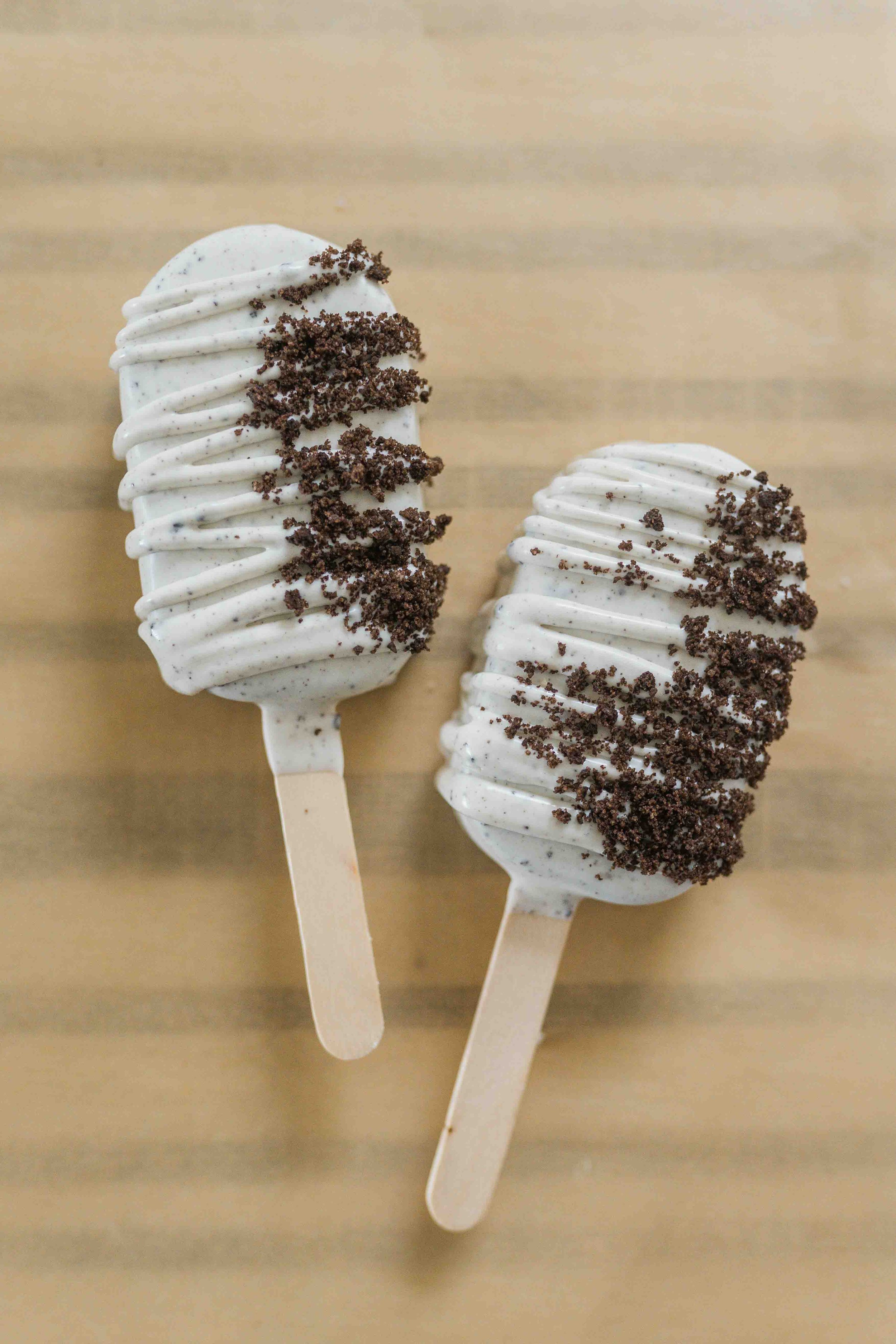 cookie and cream cake pops with cookie crumbs on the outside