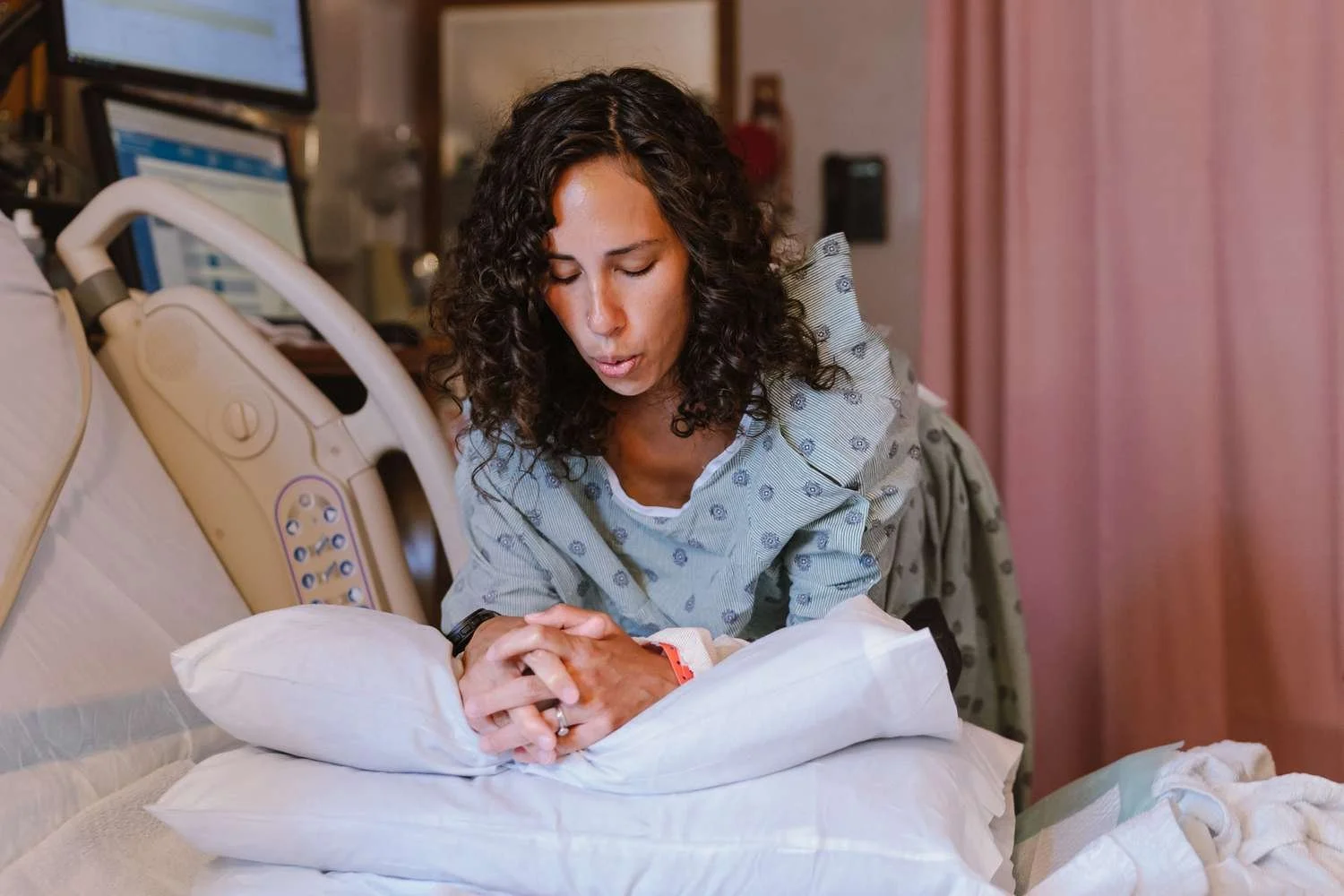 Mother holding baby after birth