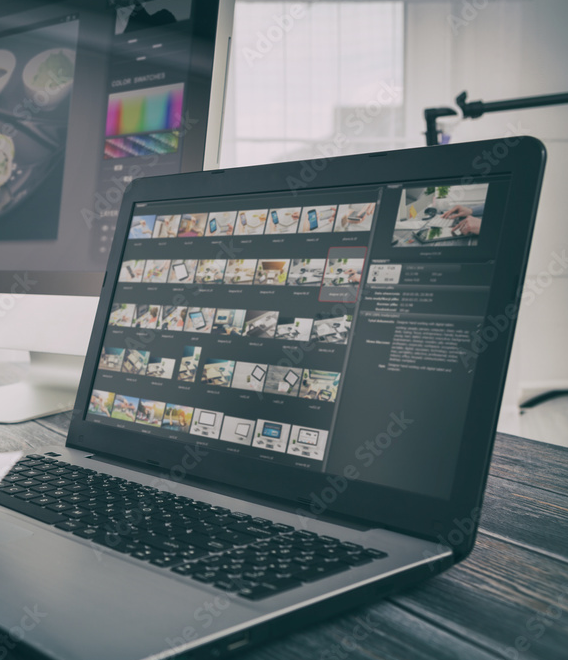 Computer showing photos on screen in folder to organize