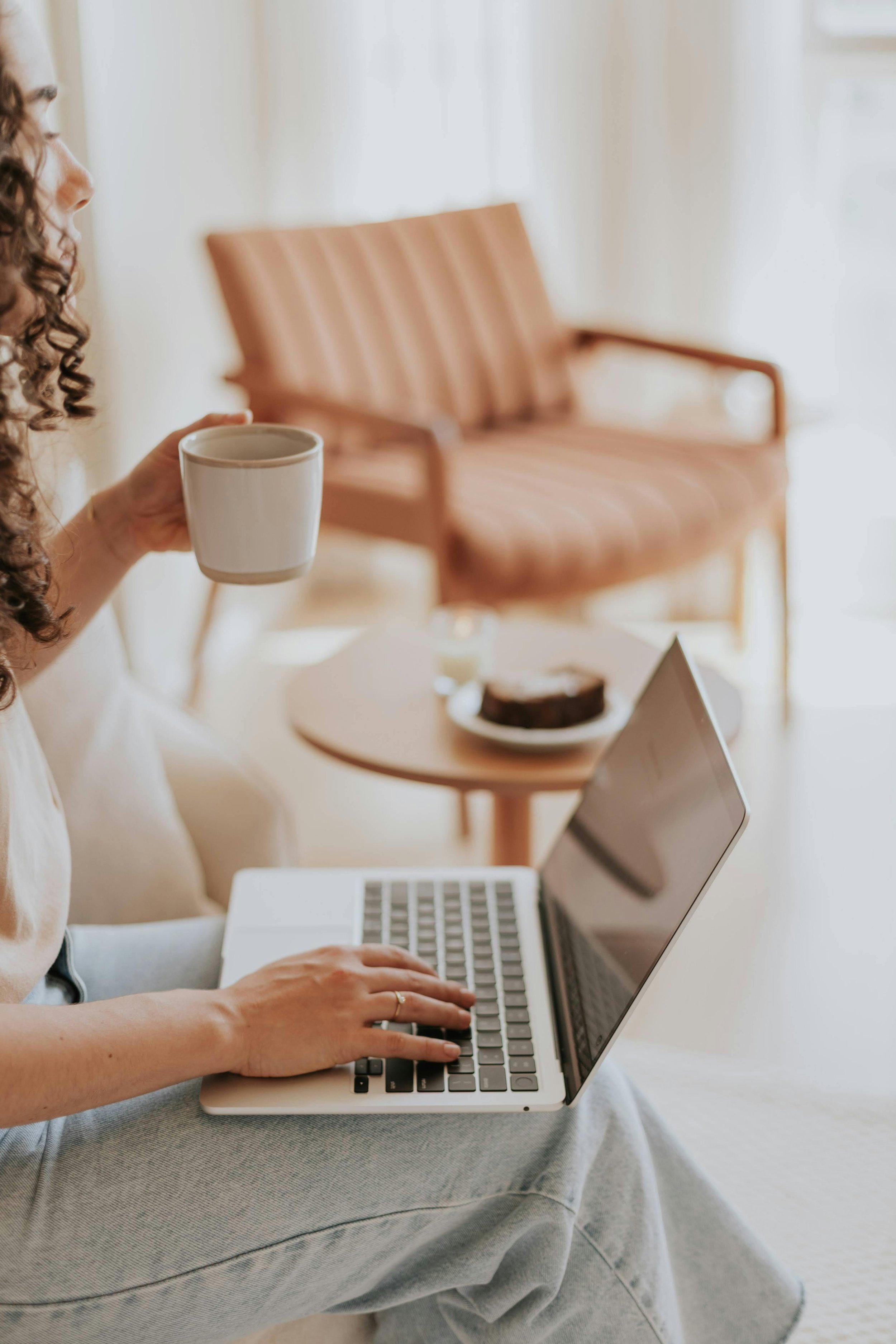 Business owner working on their website while having a coffee