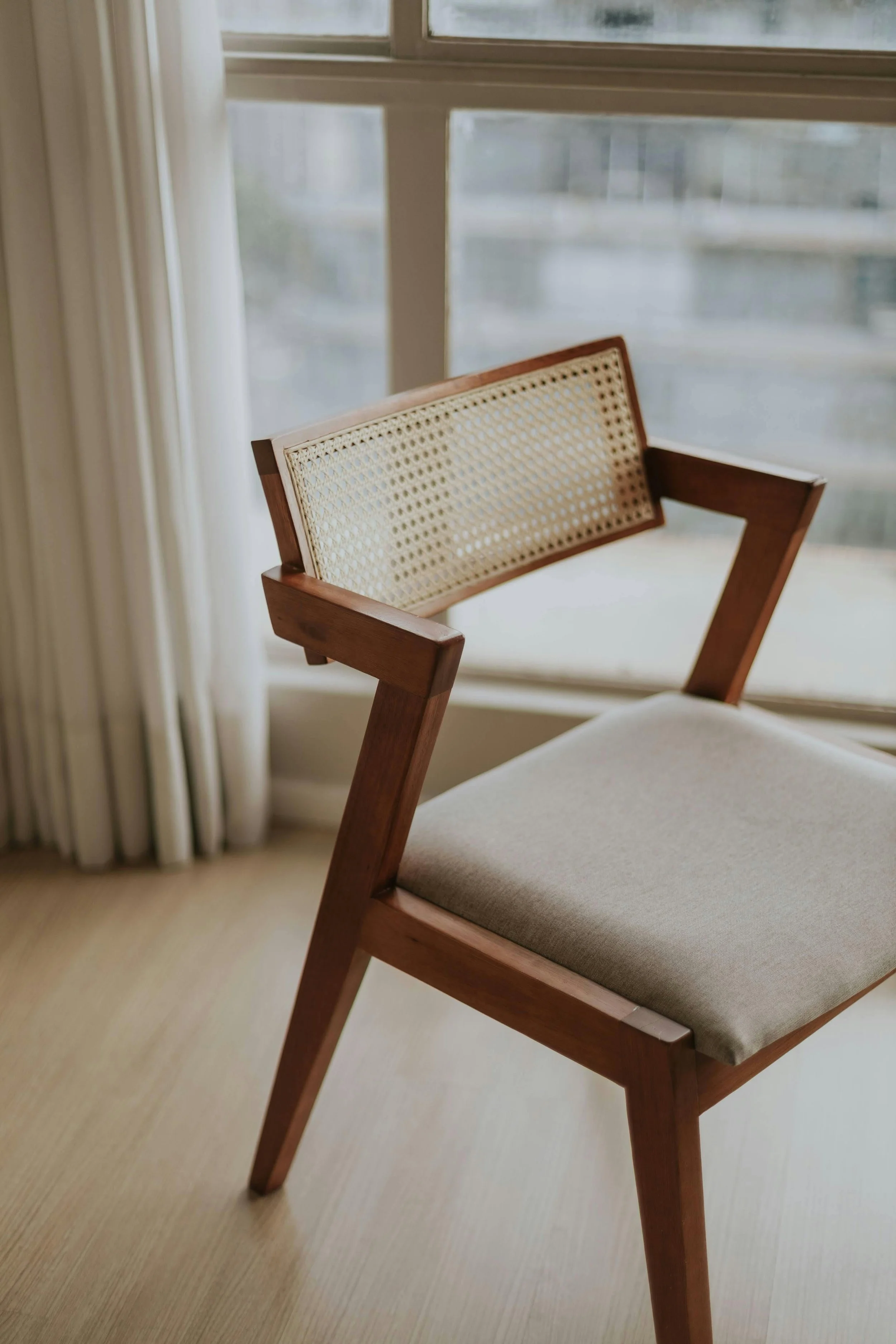 Simple wooden chair in a neutral, minimal interior