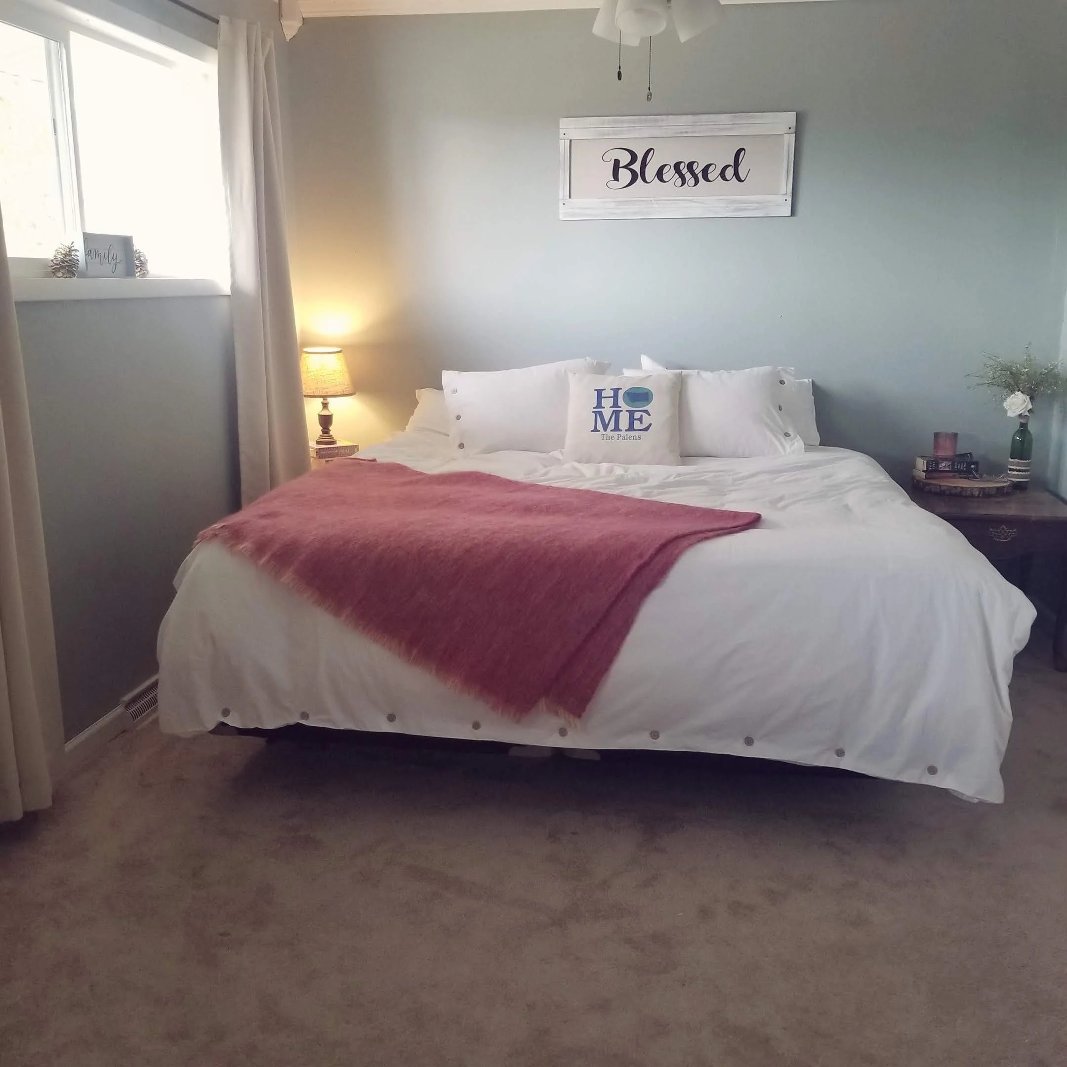 Tidy bedroom with made bed, clean surfaces, and organized decor.