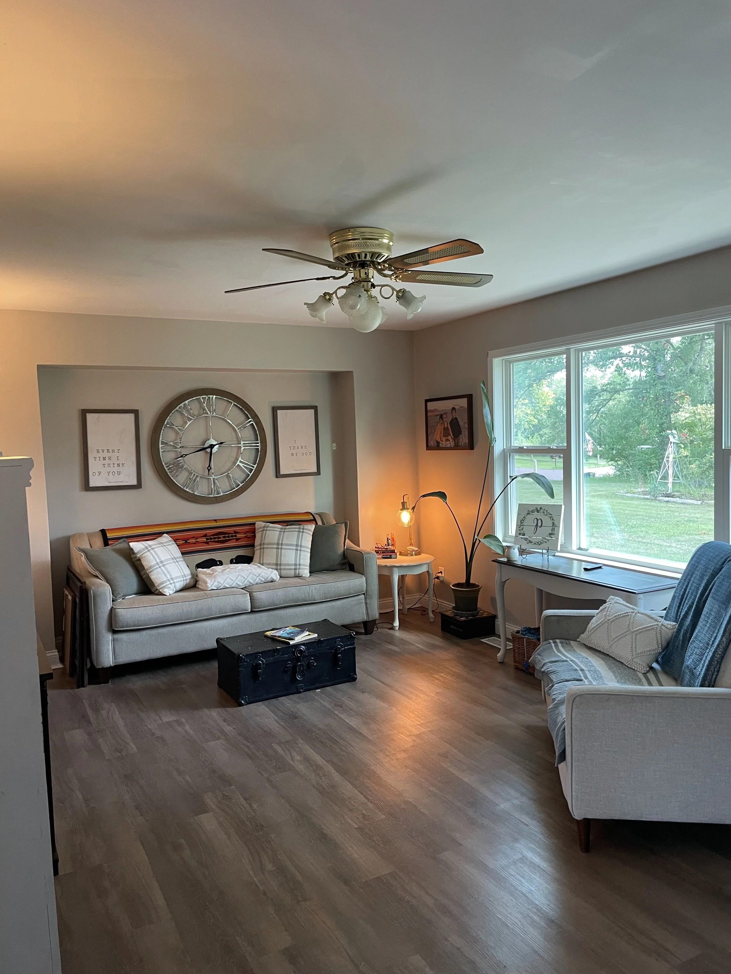Clean living room with sofa, coffee table, and tidy floors.