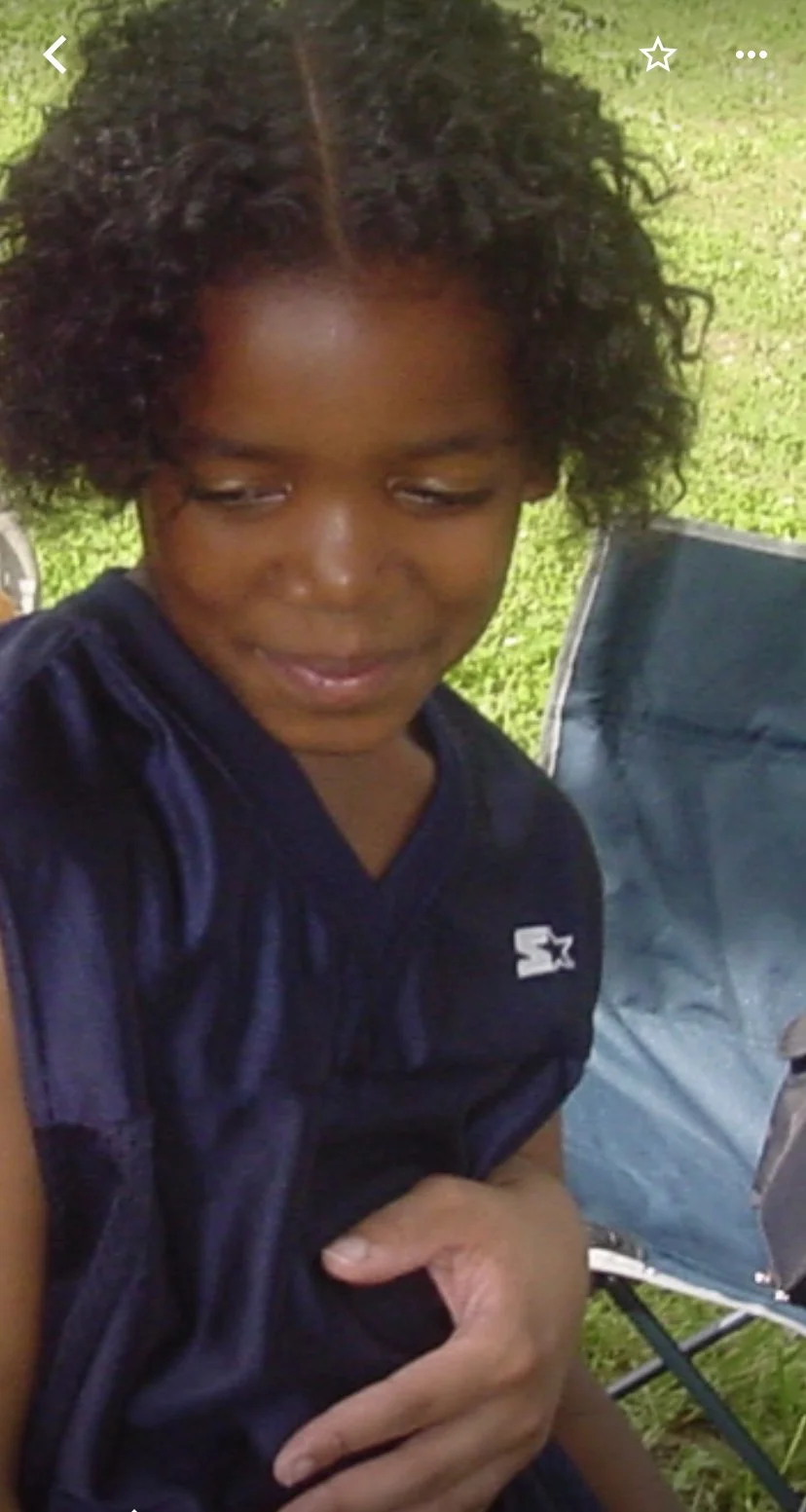 Corey as a toddler with long hair