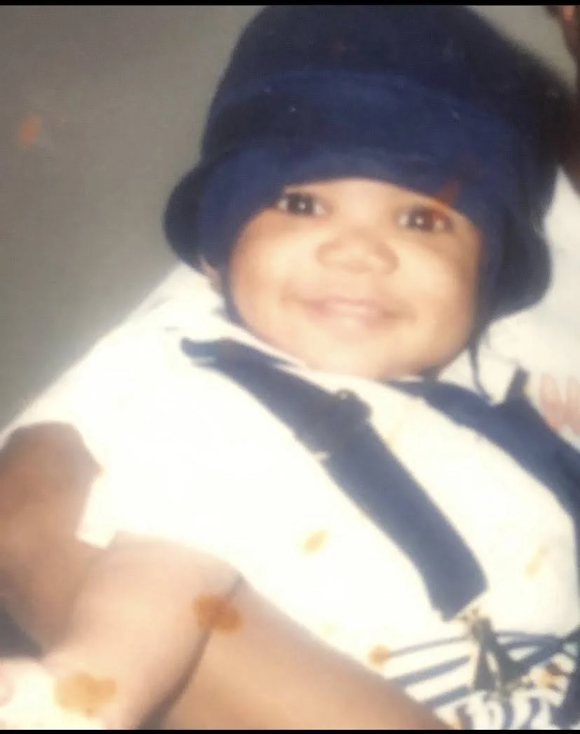 Corey as a small baby, smiling
