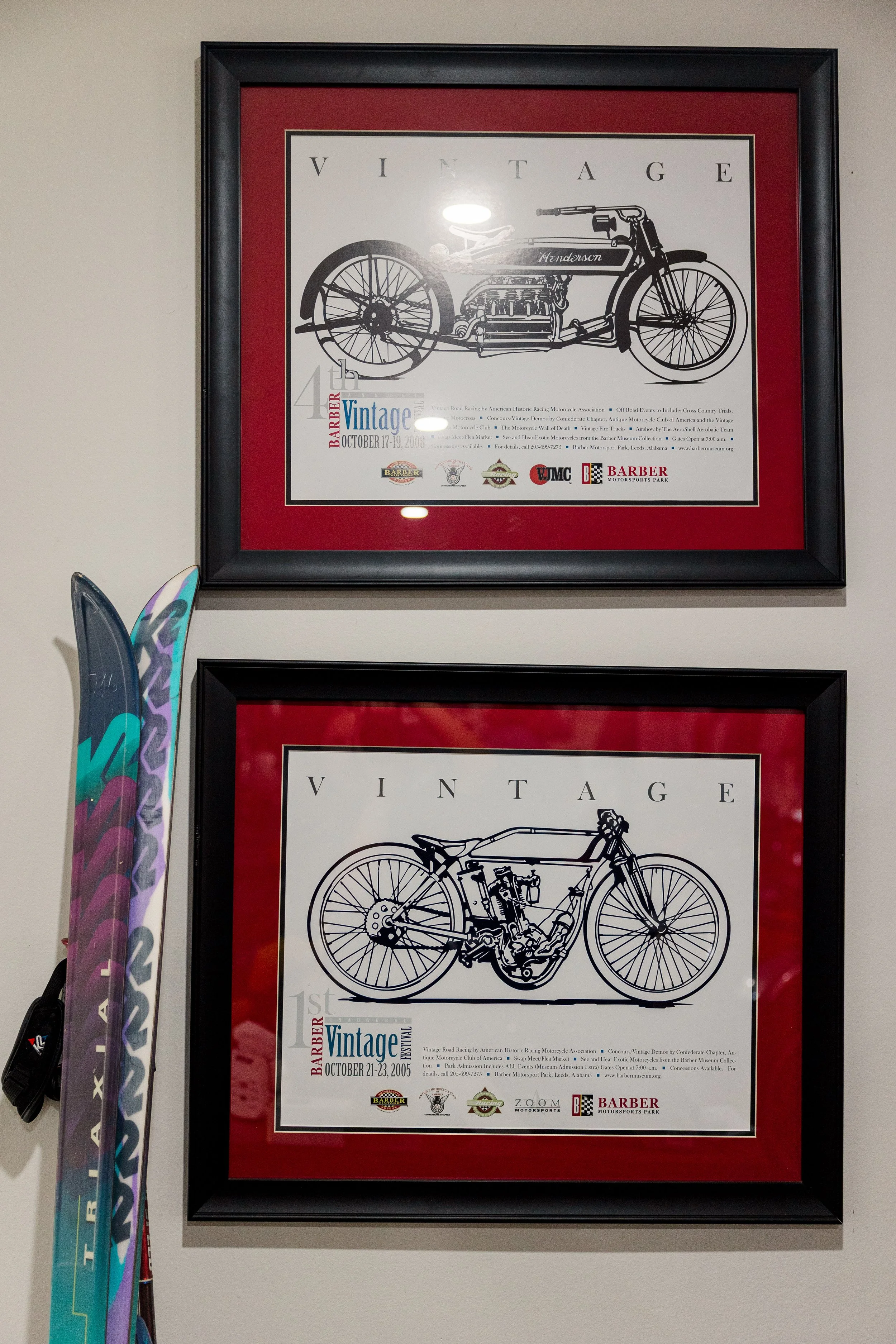 Framed poster advertising a vintage motorcycle festival at Barber Motorsports Park in Leeds, Alabama, held October 17-19, 2008, featuring illustrations of vintage motorcycles and logos of sponsors. Inside Birmingham Vintage Cycle, a vintage motorcycl