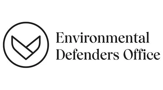 Logo of the Environmental Defenders Office featuring a circular emblem with a stylized check mark or leaf inside, and the organization name written to the right.