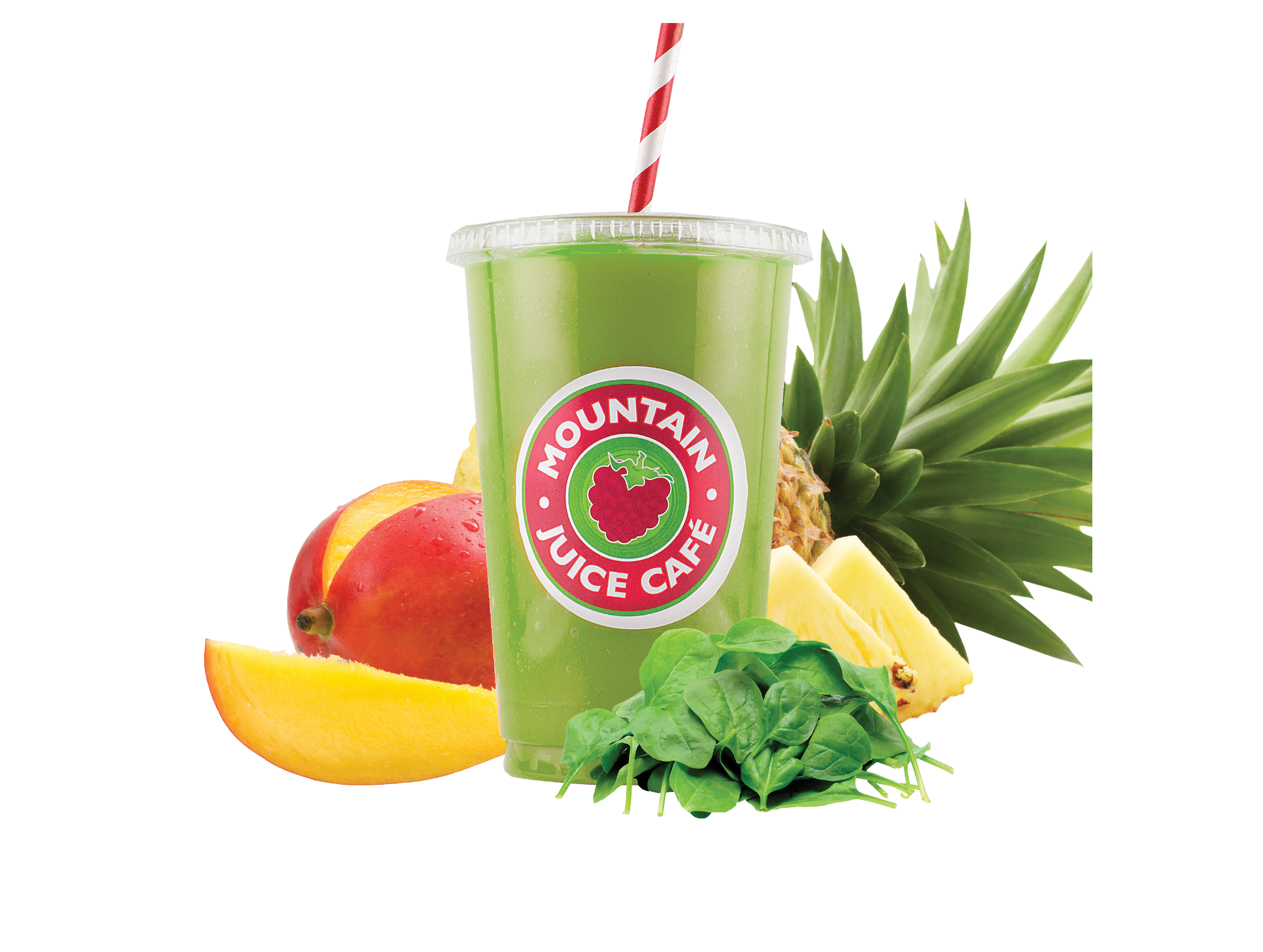 The Go Green smoothie from Mountain Juice Cafe in a cup with a red and white striped straw surrounded by fresh tropical fruits including mango, pineapple and spinach leaves.