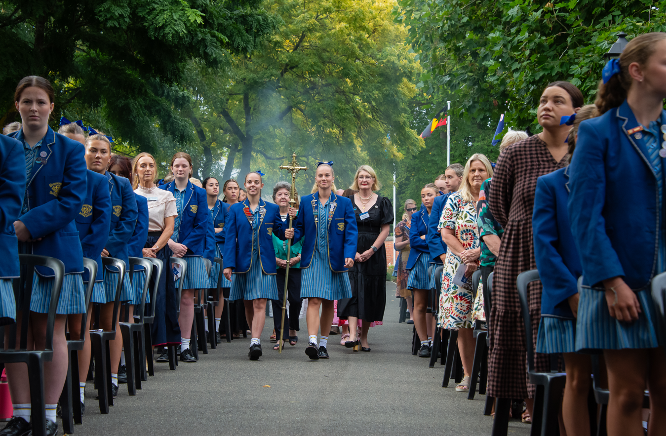 Loreto College Ballarat students leading the 150 Years Celebration Mass procession with Loreto Ministries Chair Margaret Kennedy and Sr Helen Maguire CJ, March 2025