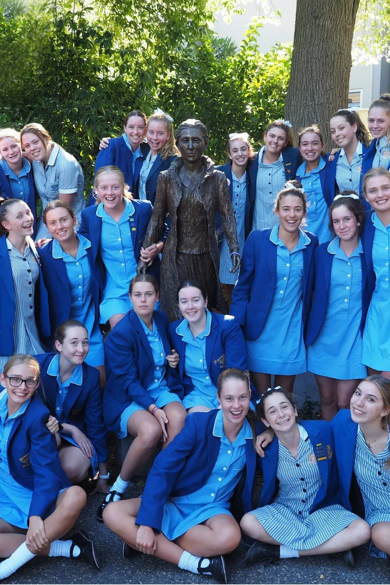 Loreto students gathered around a statue of Mary Ward, founder of the Loreto tradition of Catholic education