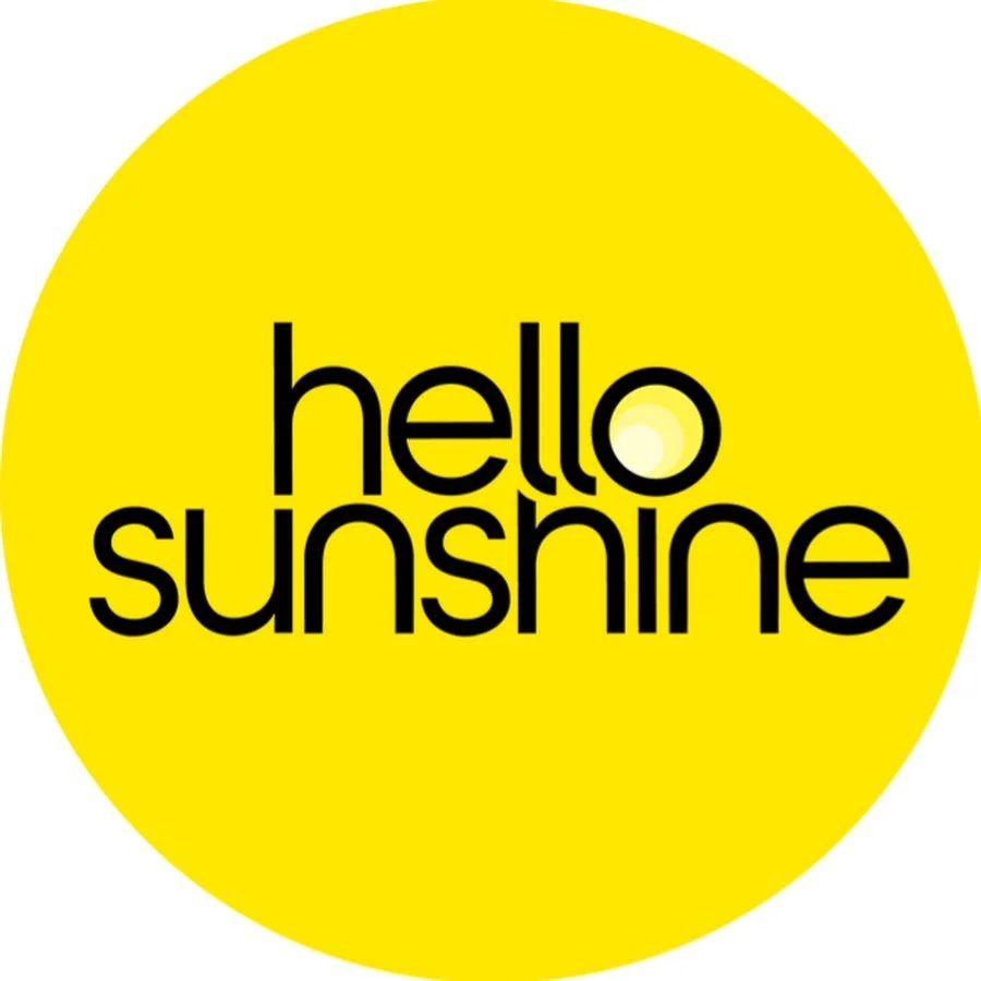 Yellow circle with the words 'hello sunshine' in black lowercase letters.