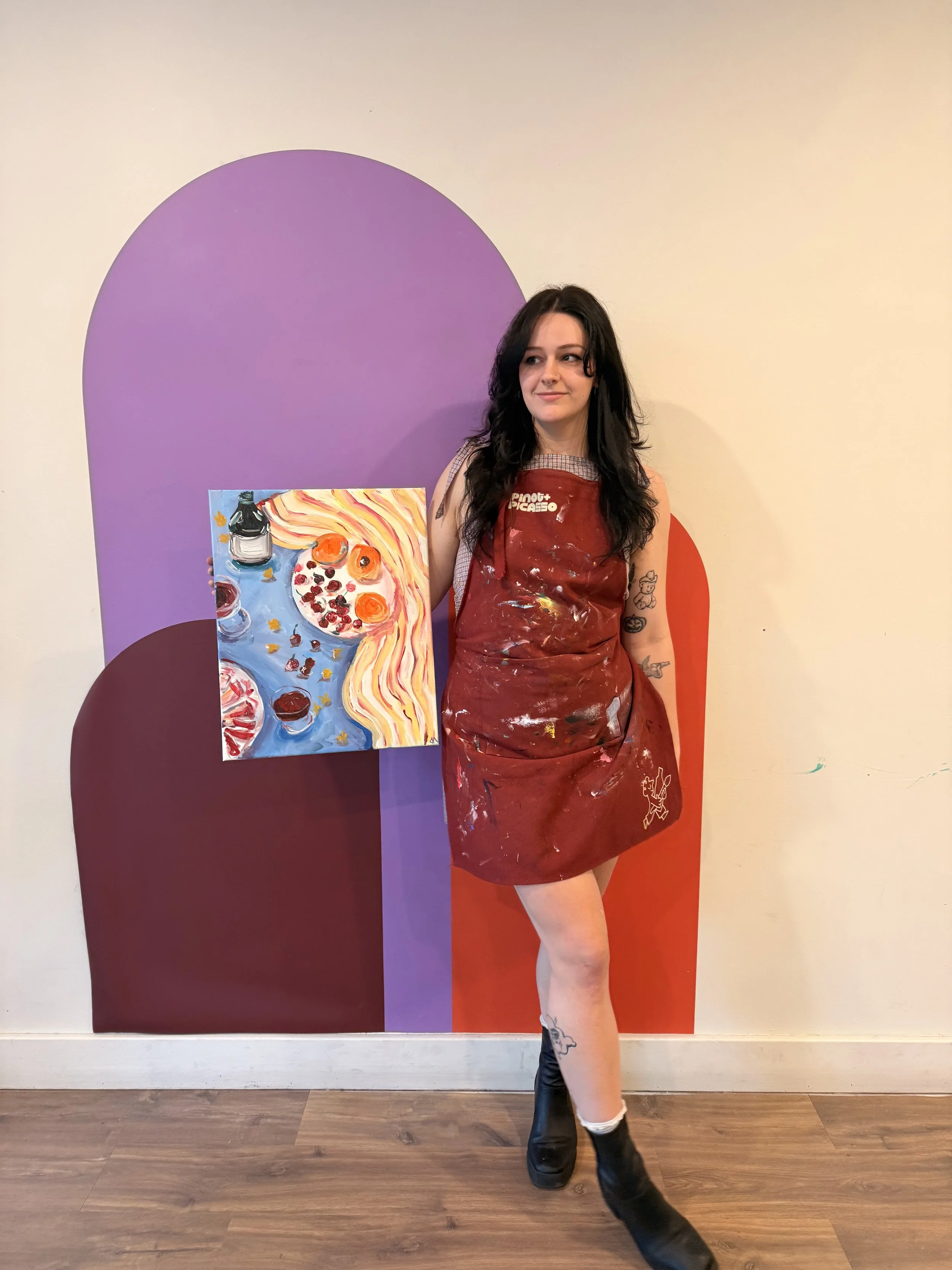 Artist holding handpainted acrylic painting