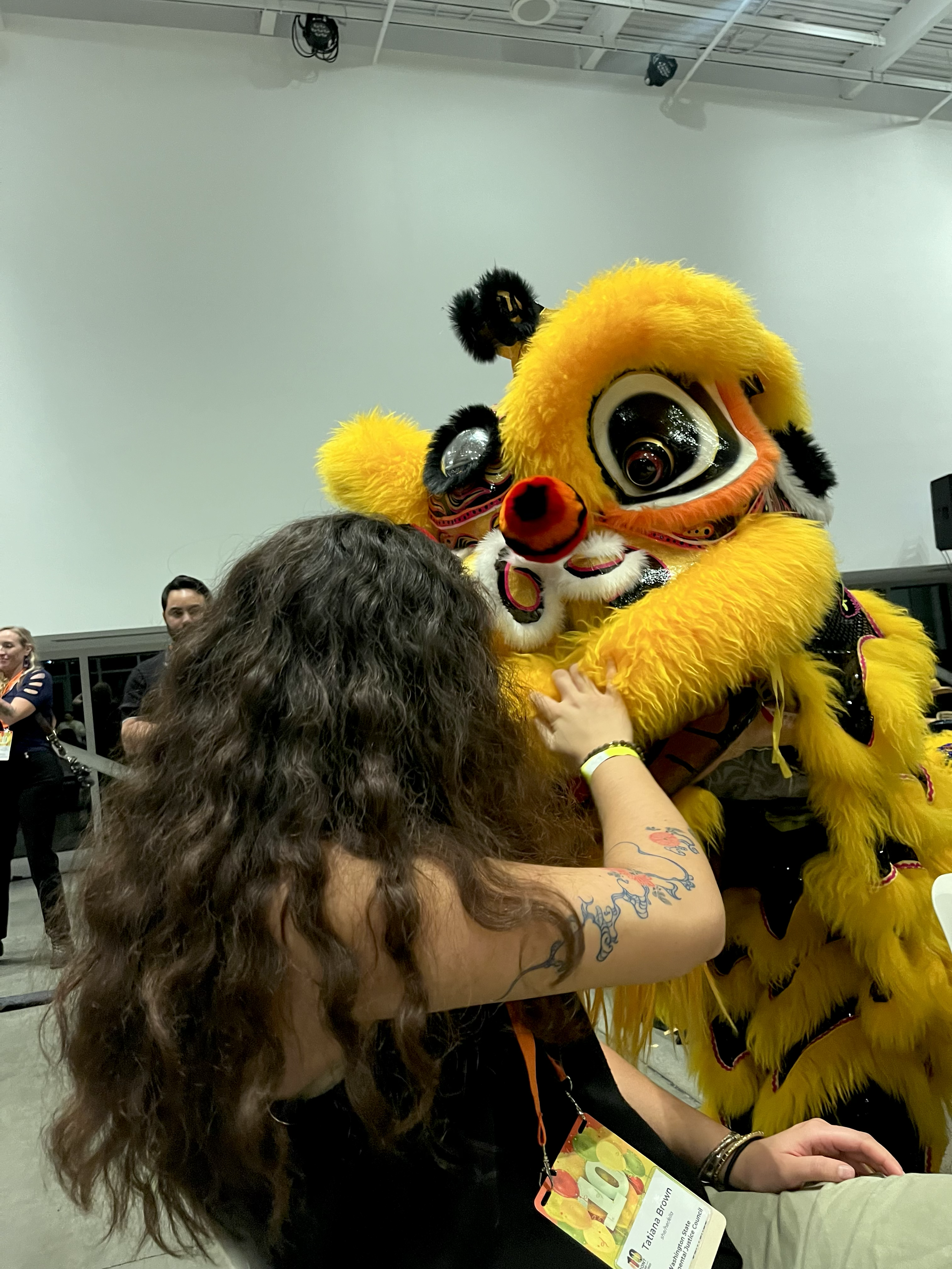Tatiana at the Front and Centered 10-year celebration, interacting in a traditional Chinese Lion Dance.