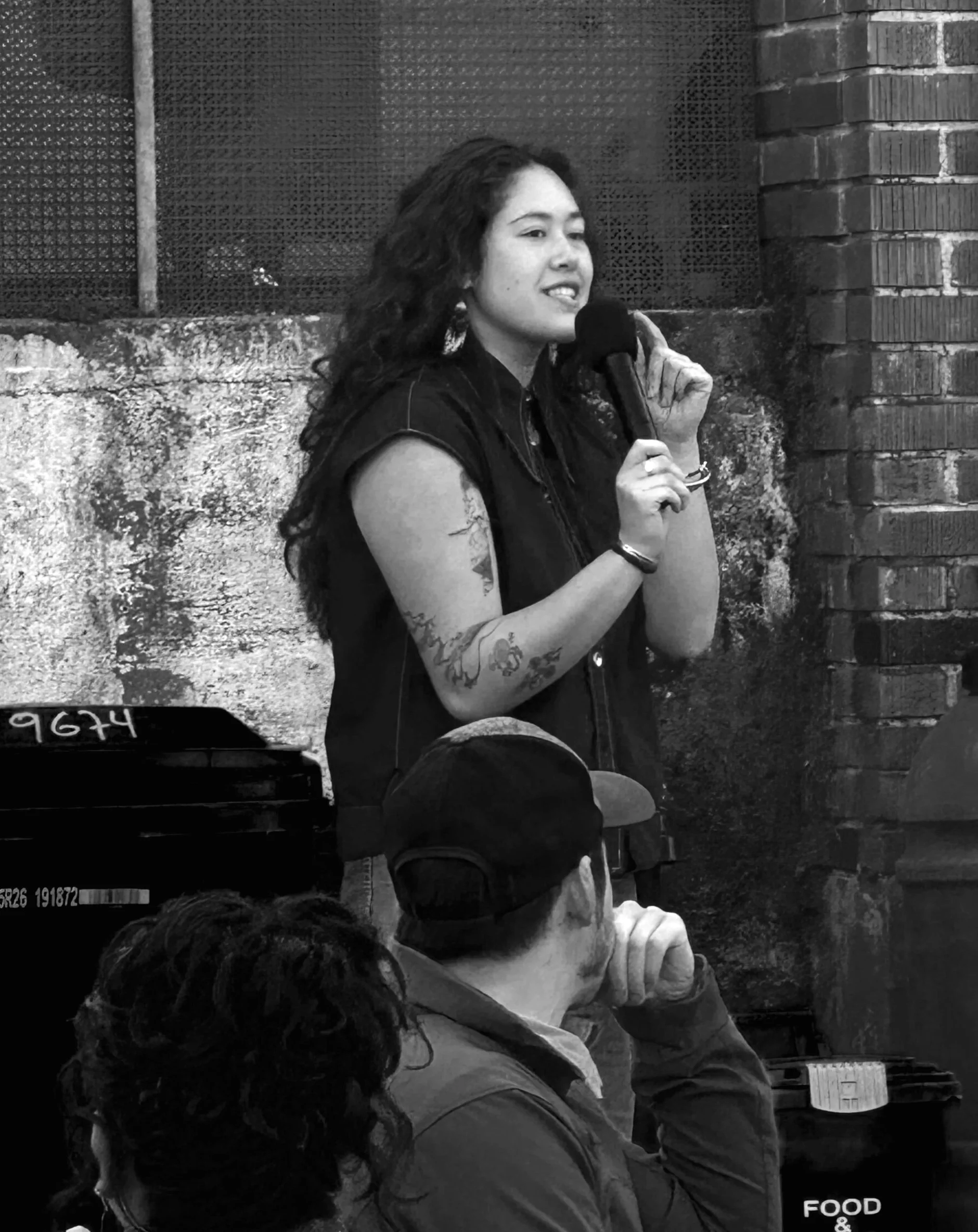 Tatiana giving a speech at her campaign launch kickoff at yehaw indigenous creatives collective in Rainier Beach.