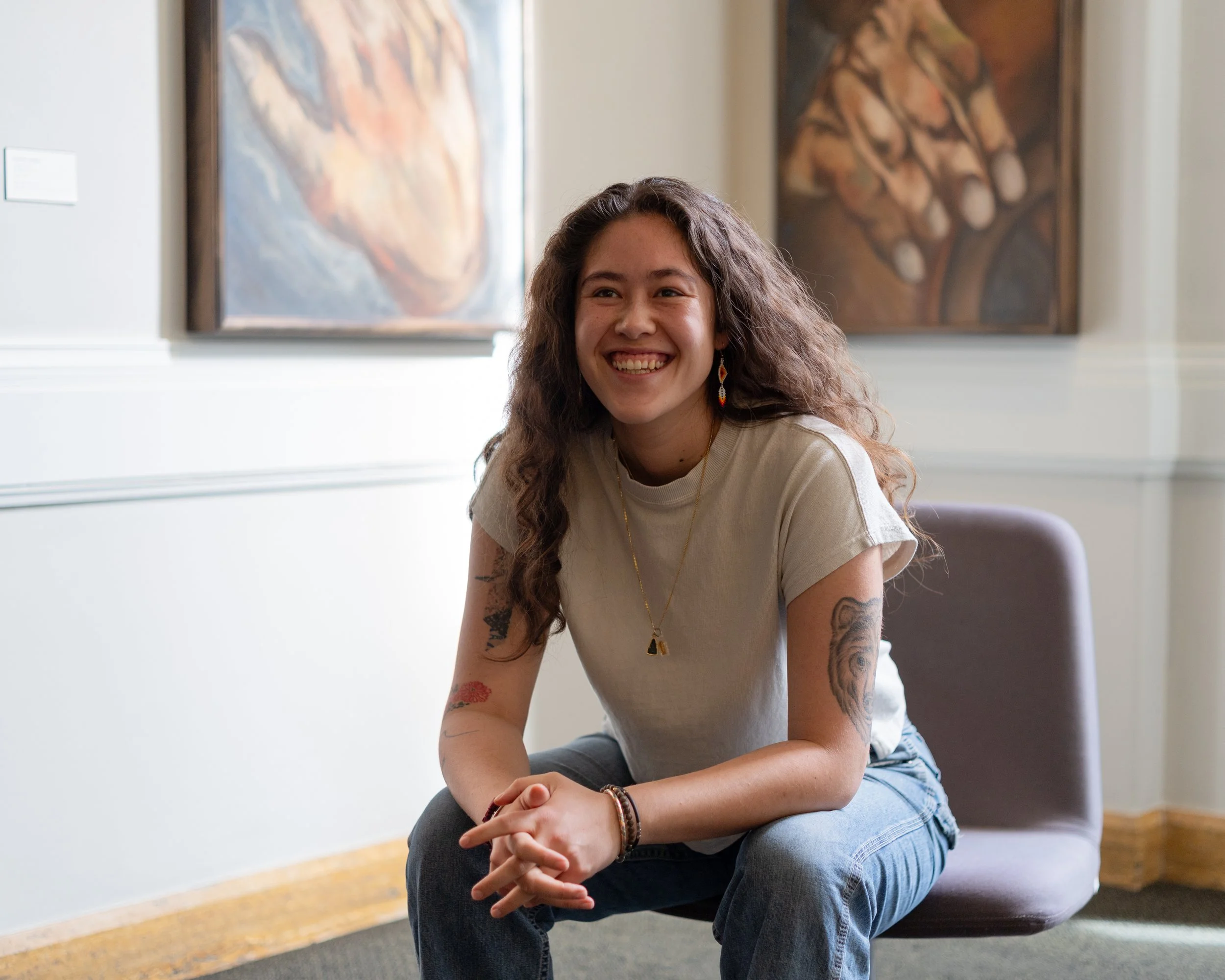 Tatiana Brown, candidate for State Senate in the 37th LD, sitting on a bench in the Pacific Medical Center located in North Beacon Hill.