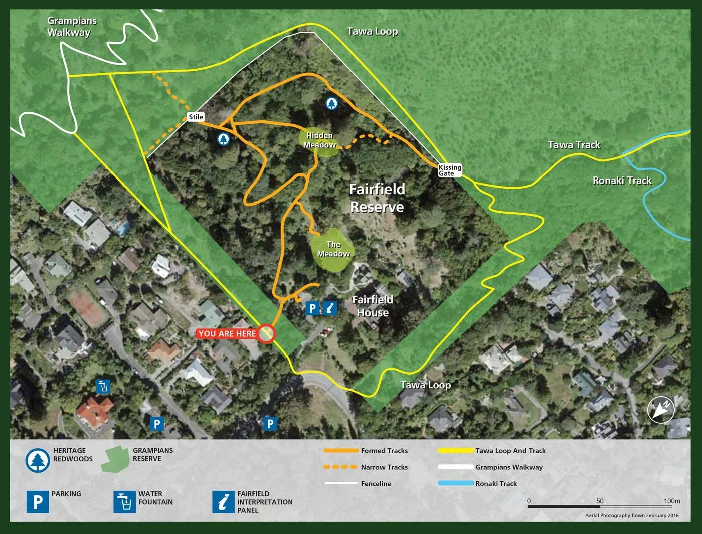 Map of Fairfield Reserve with trails, landmarks, parking, and direction marker, indicating various walking and biking loops in a forested area.
