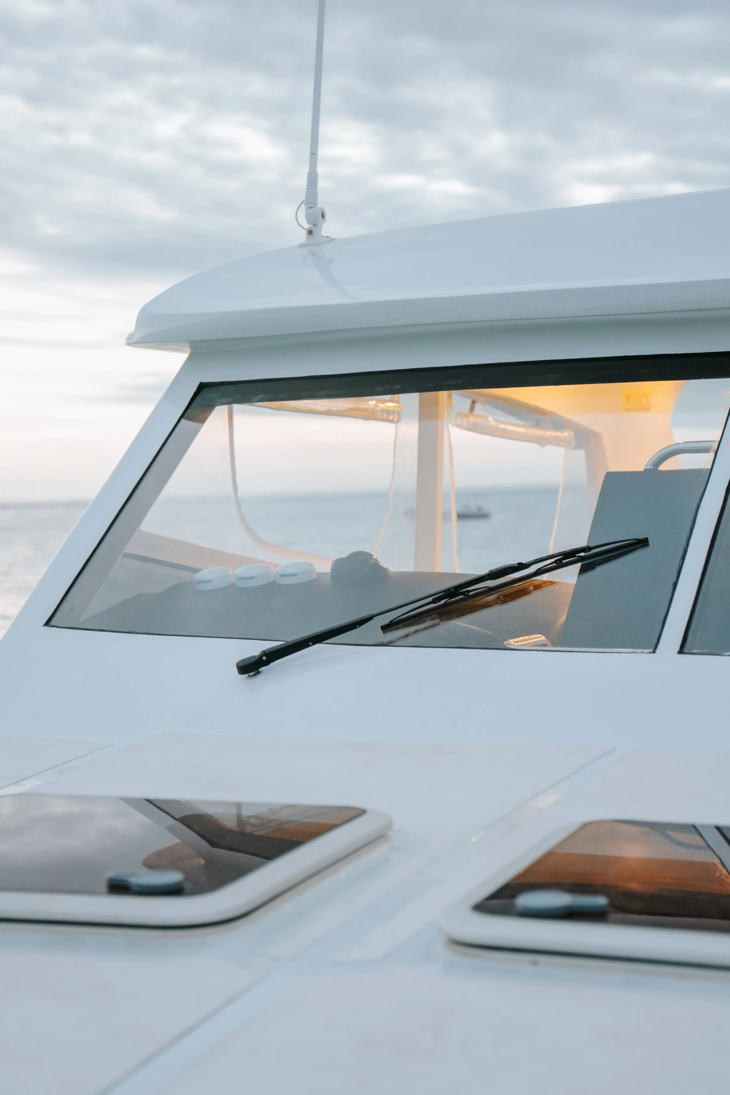 Front of the Kalm Charters vessel cruising on open water.