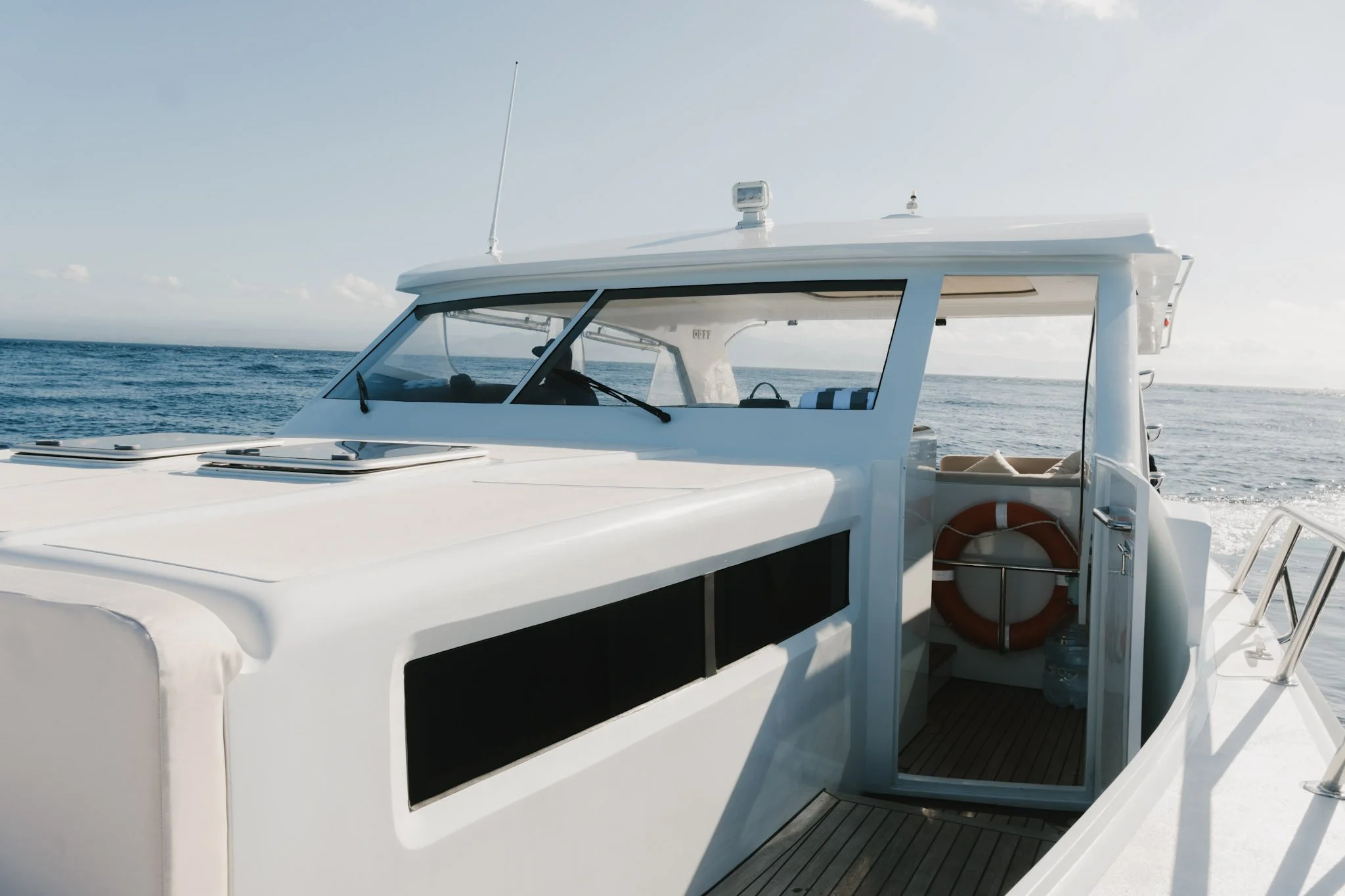 Kalm Charters luxury private charter vessel cruising between Bali and Nusa Lembongan.