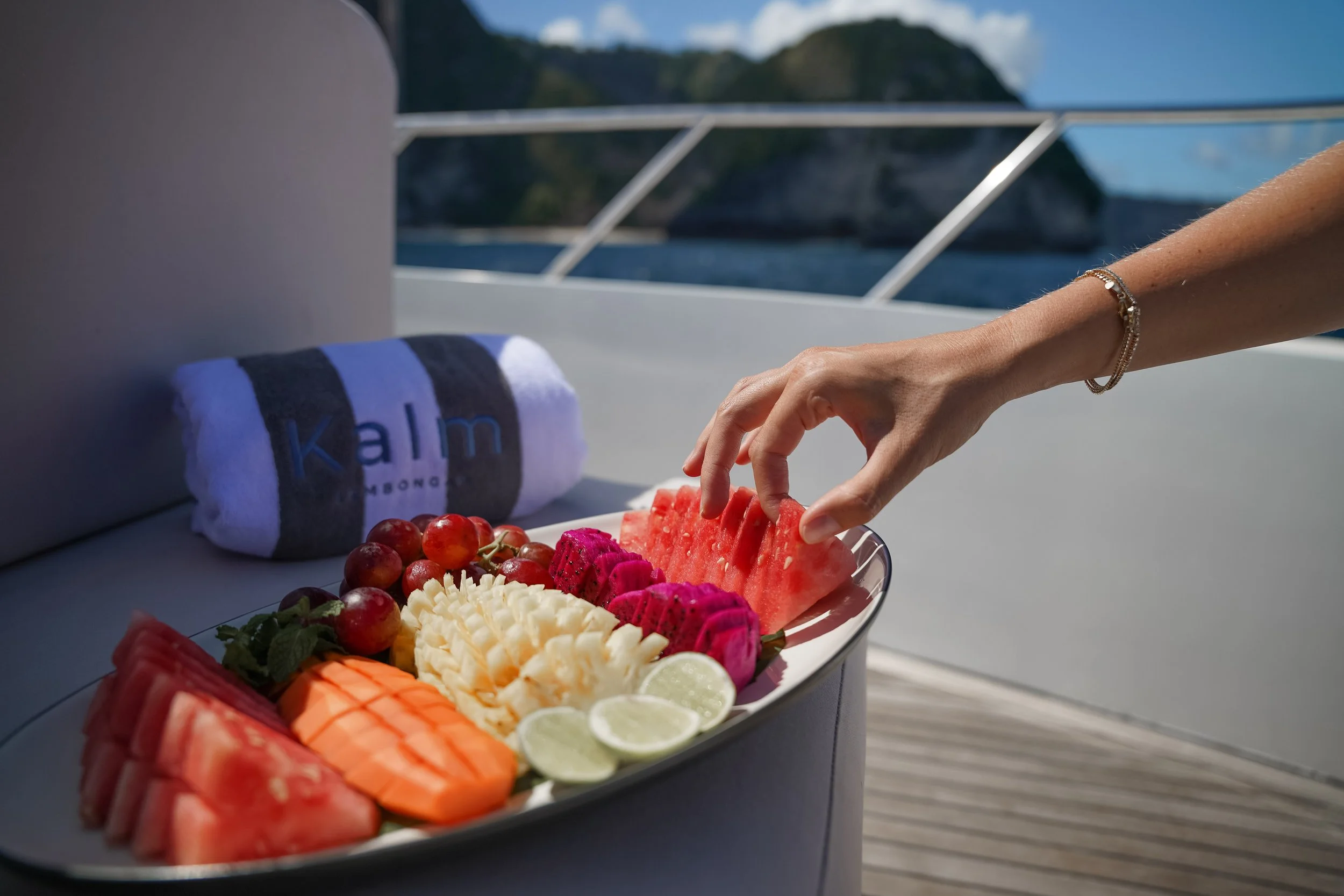 Fresh fruit and refreshments prepared onboard for a Kalm Charters experience.