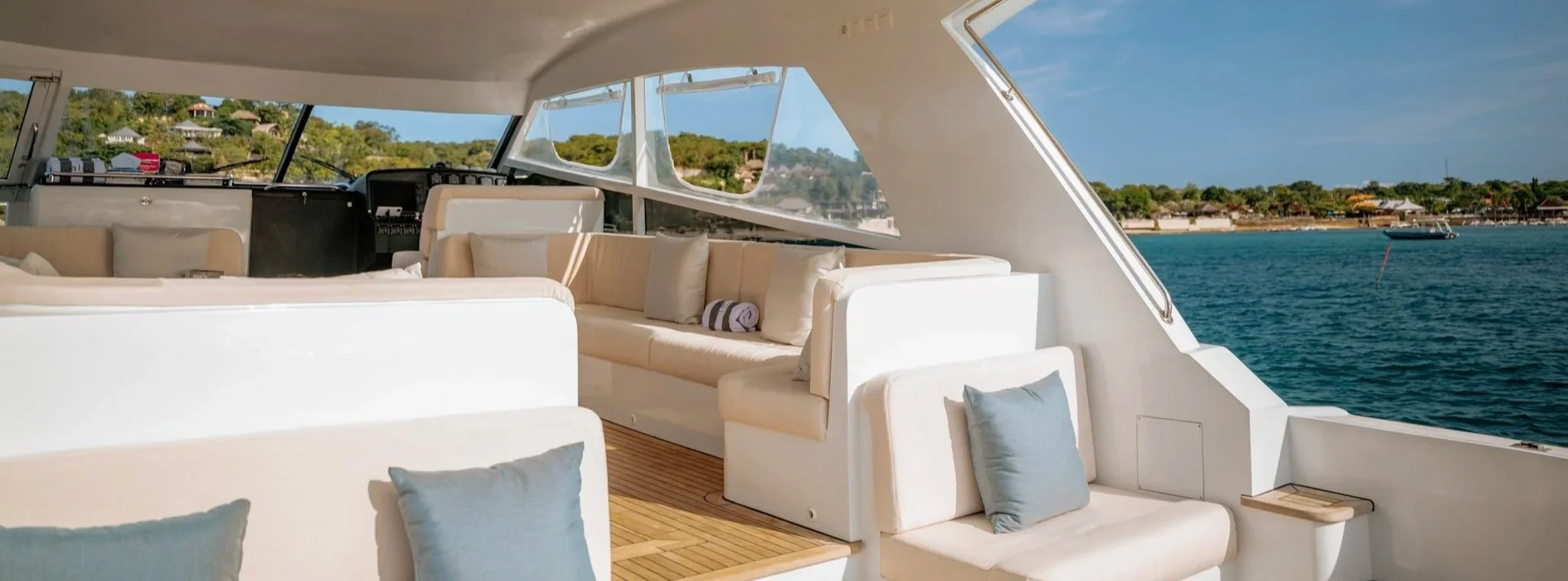 Exterior lounge with ocean views aboard the Kalm Charters vessel.