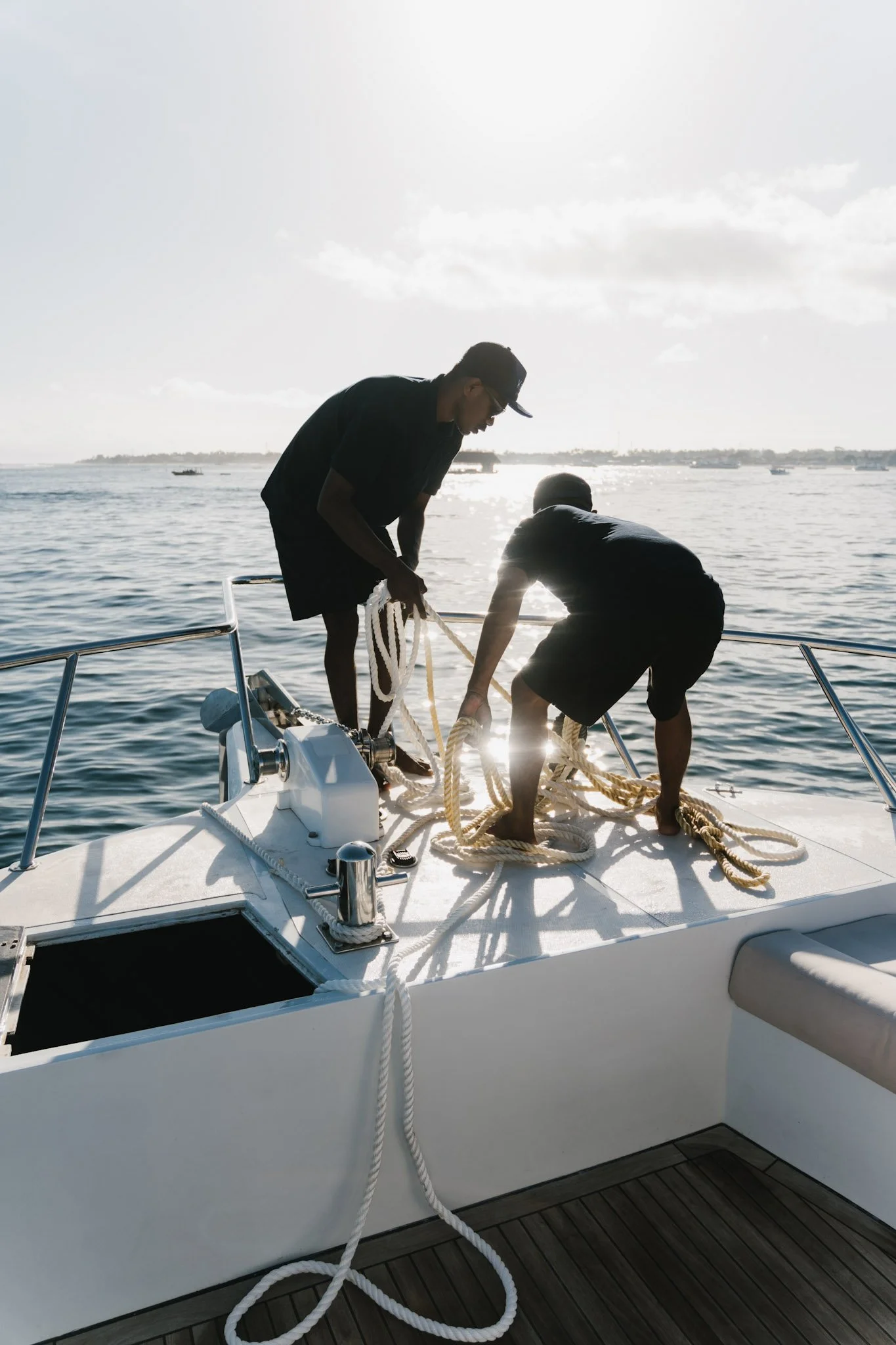 Crew preparing the Kalm Charters vessel before departure.